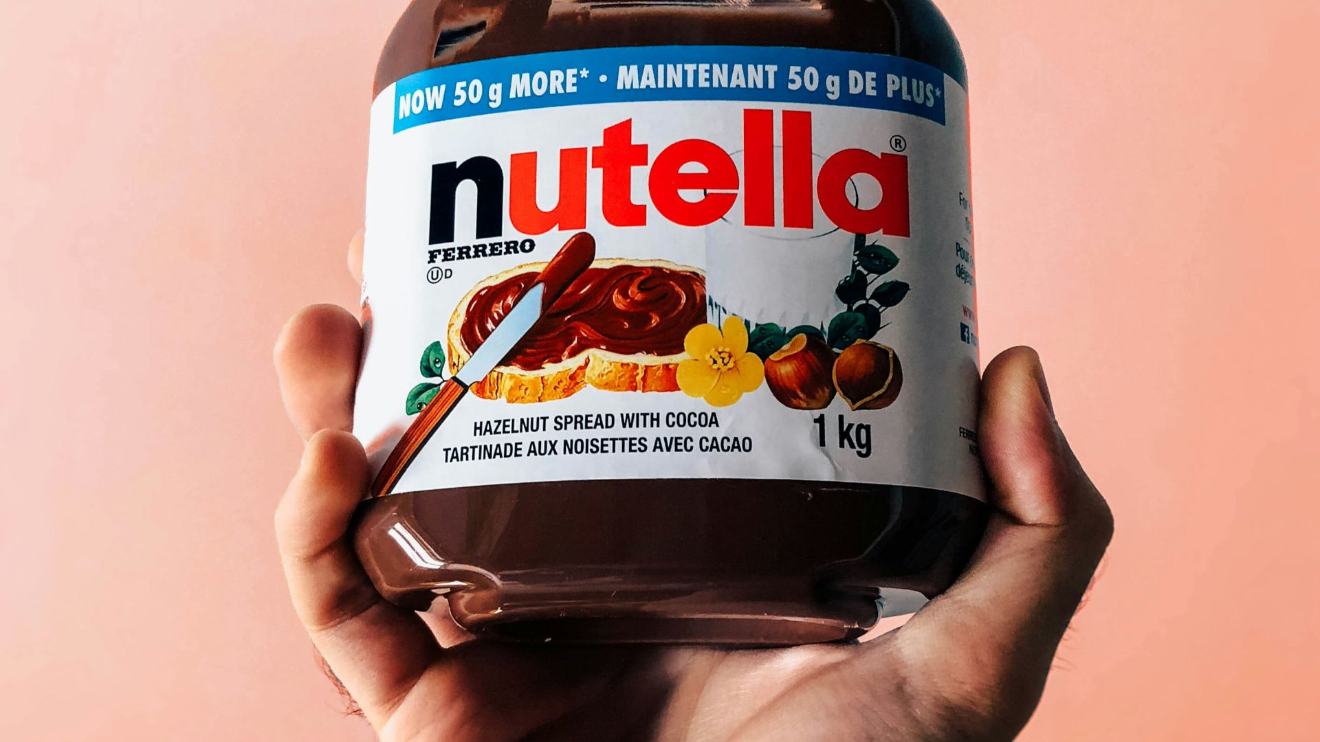 person holding Nutella jar