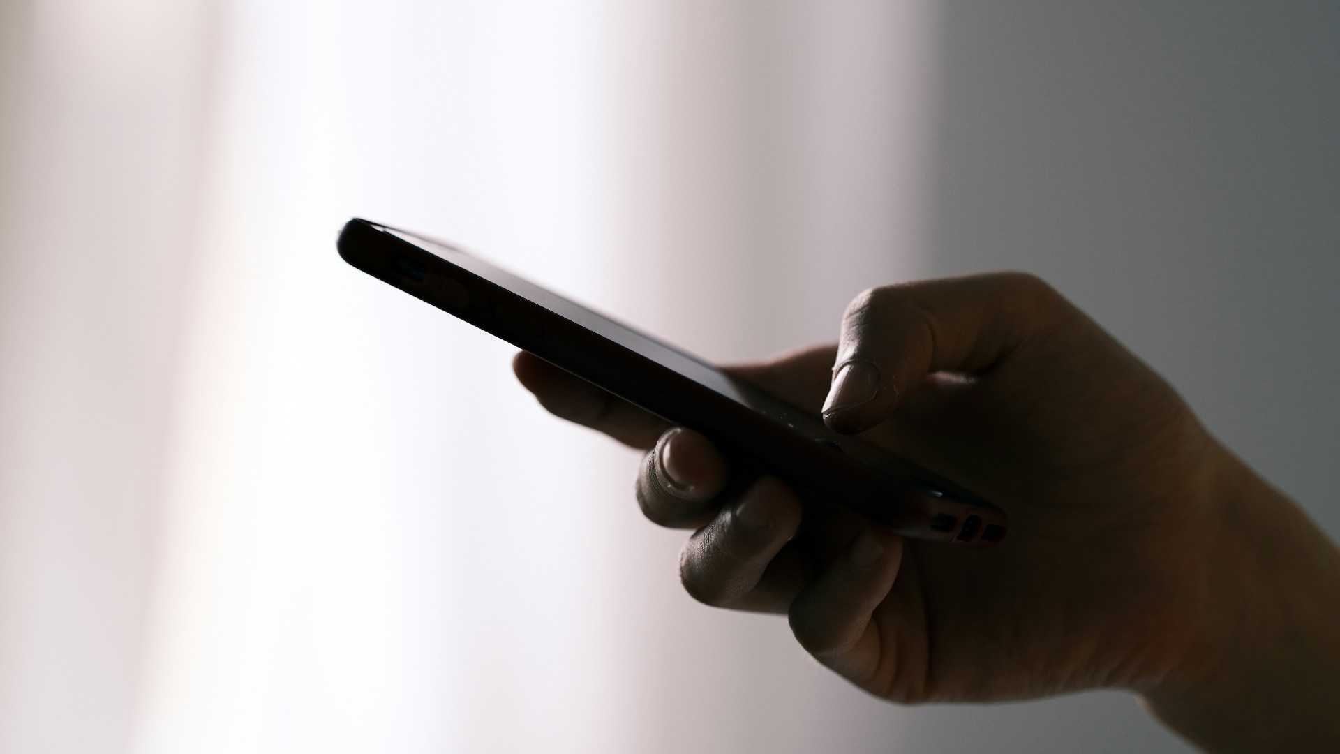 person holding black android smartphone