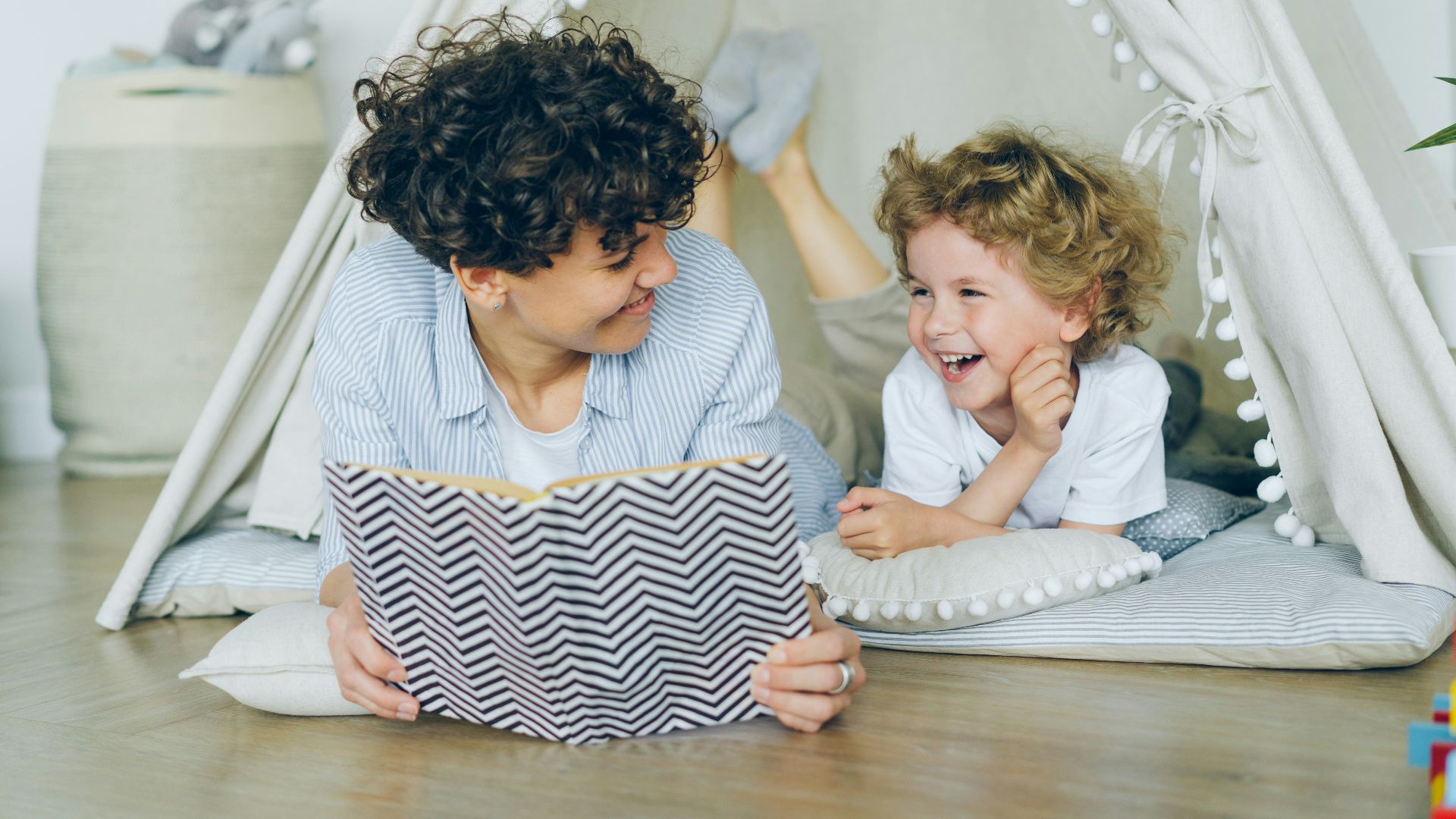a woman reading a book to a child