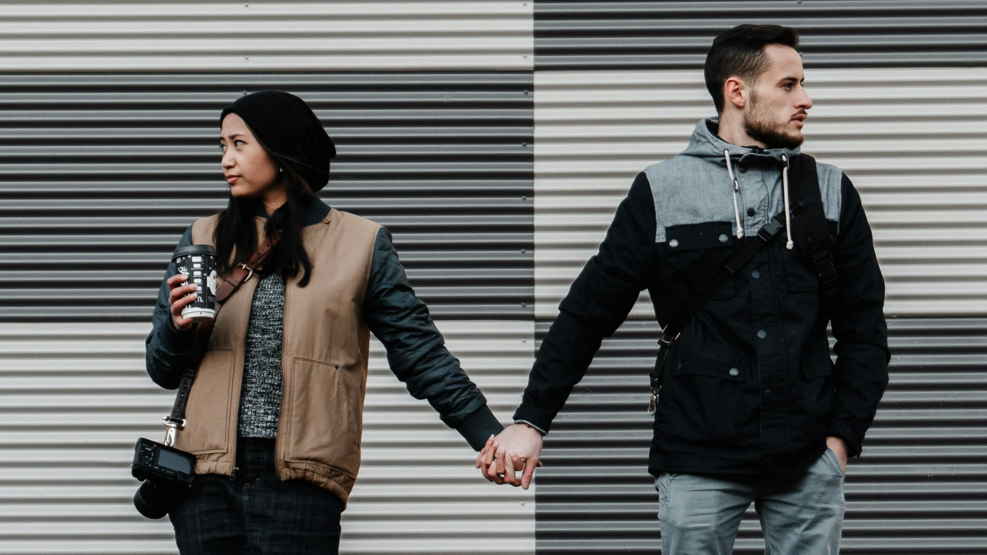 man and woman holding each other's hands