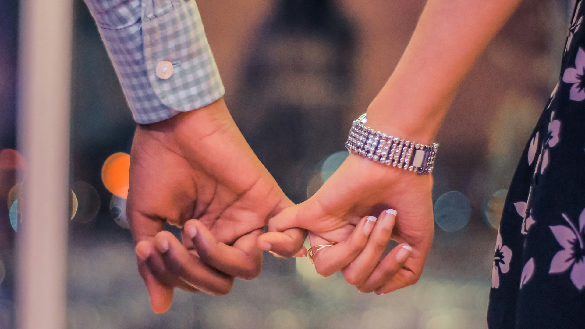 man and woman holding hands