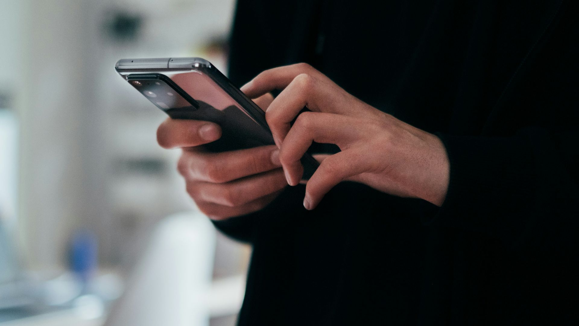 person holding black android smartphone