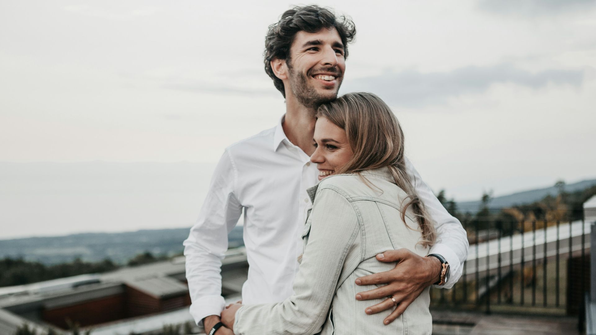 man and woman hugging each other