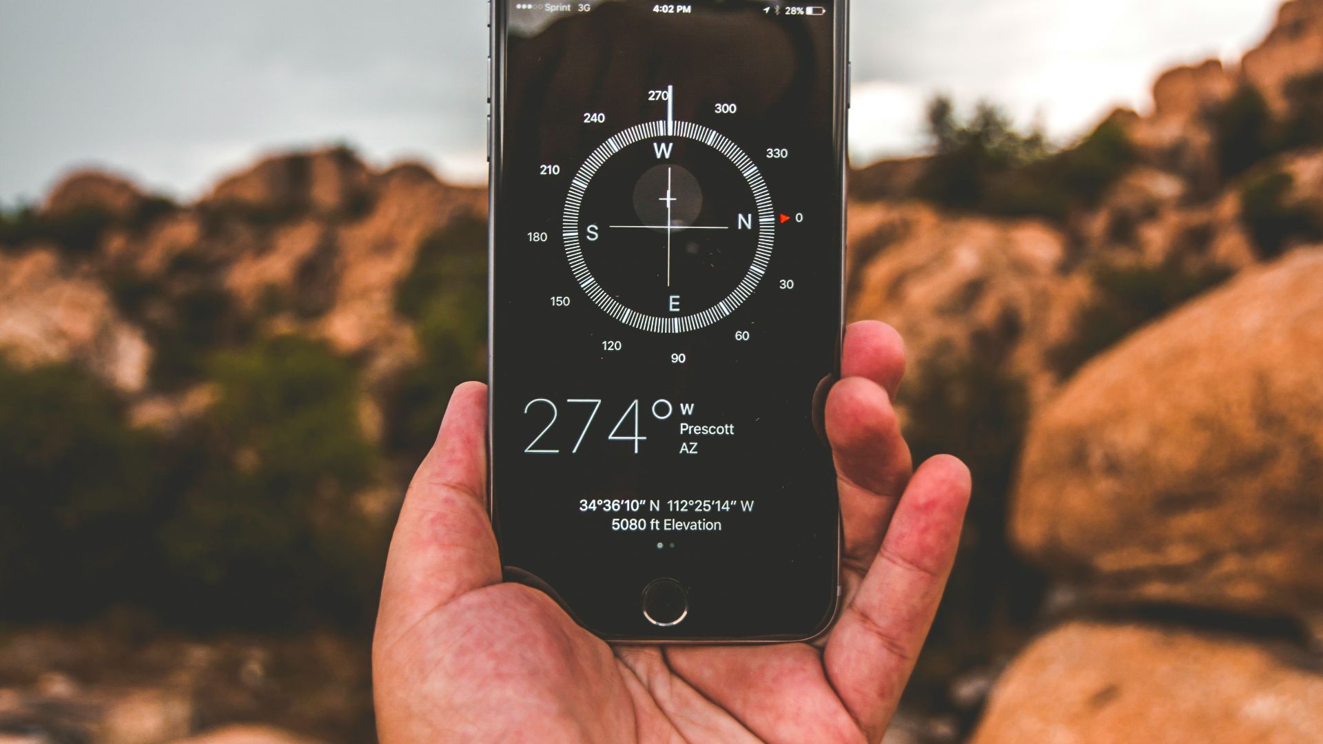 selective focus photography of person holding space gray iPhone 6