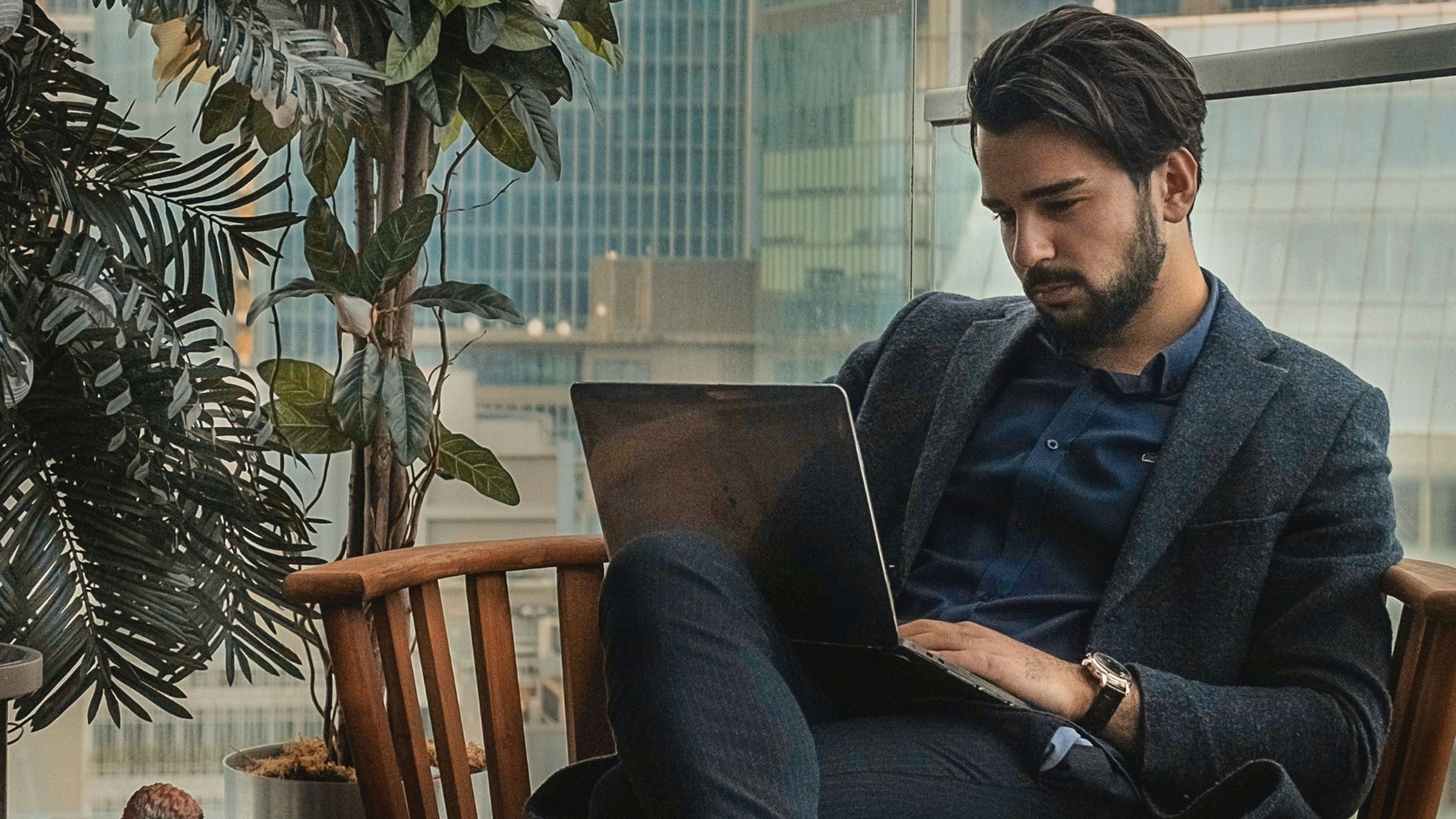 man sitting beside side table
