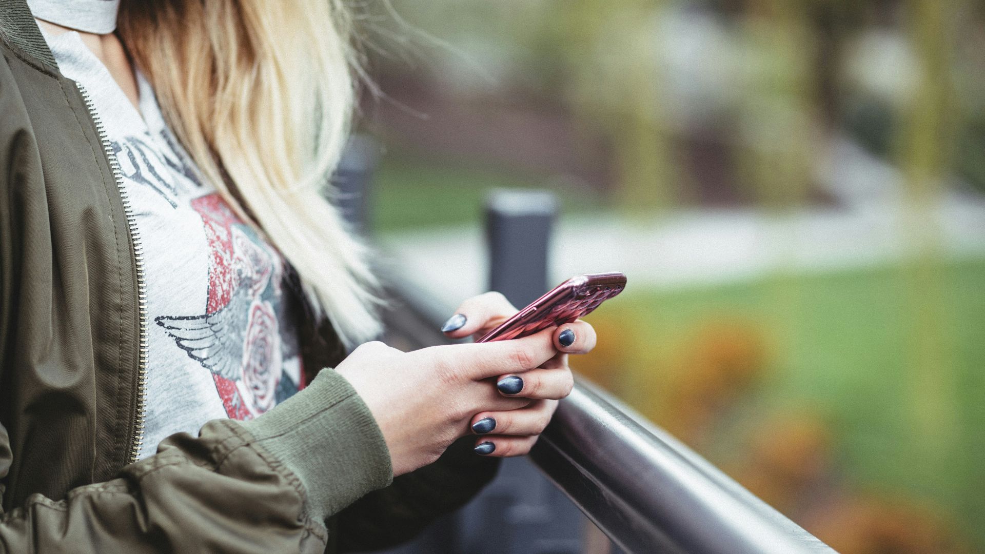 woman holding red phone