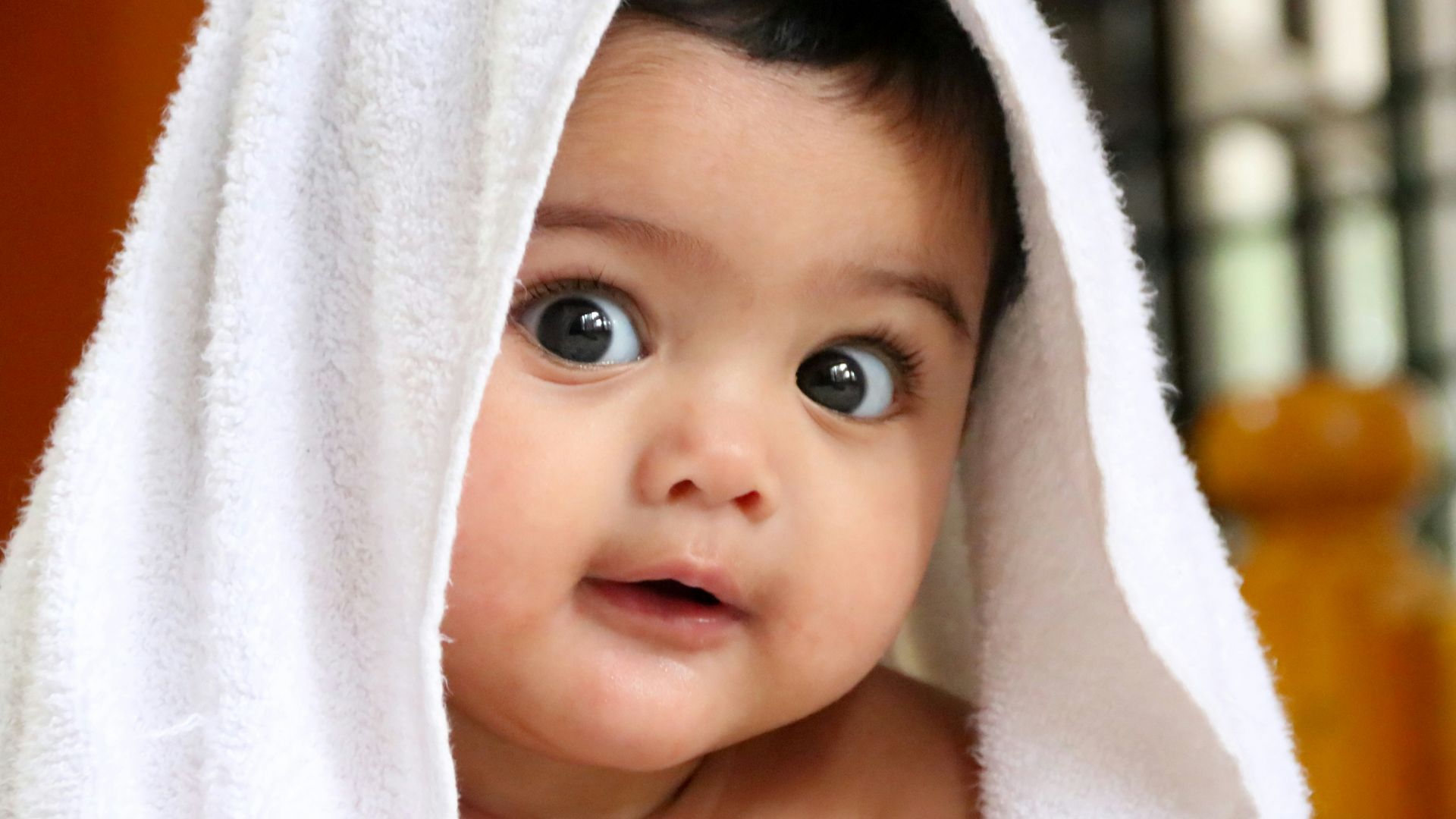 girl covered with white towel