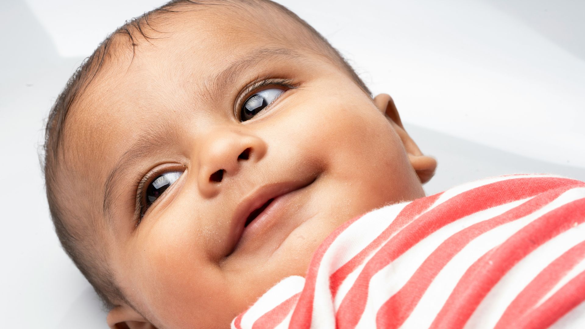 baby's orange and white striped shirt