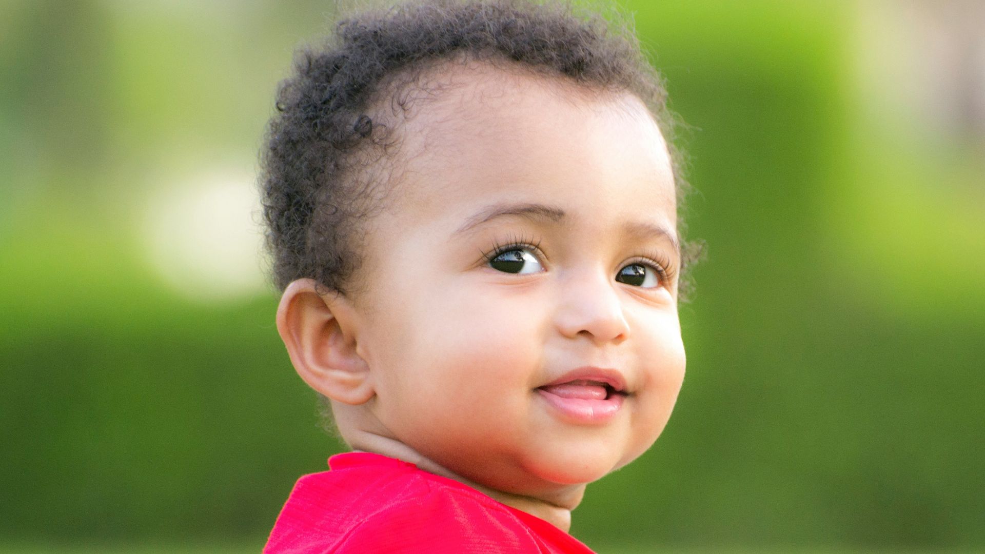 a baby with a red shirt
