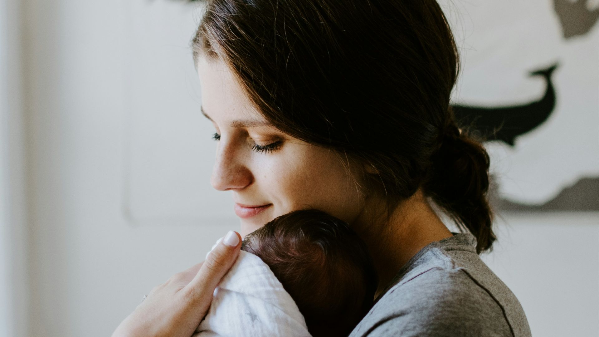 mother carrying baby