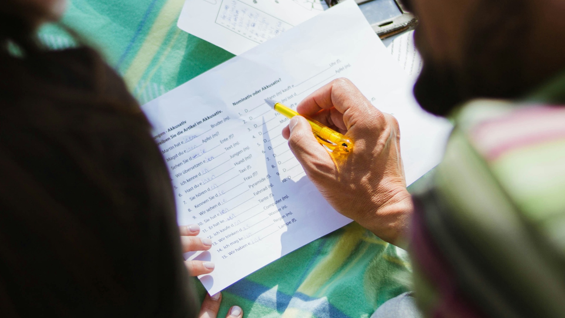 man in black shirt sitting beside woman in gray shirt