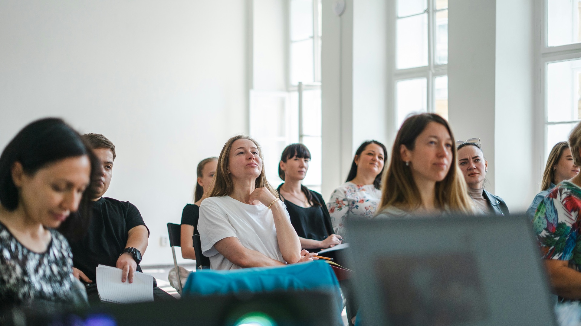 a group of people sitting at computers