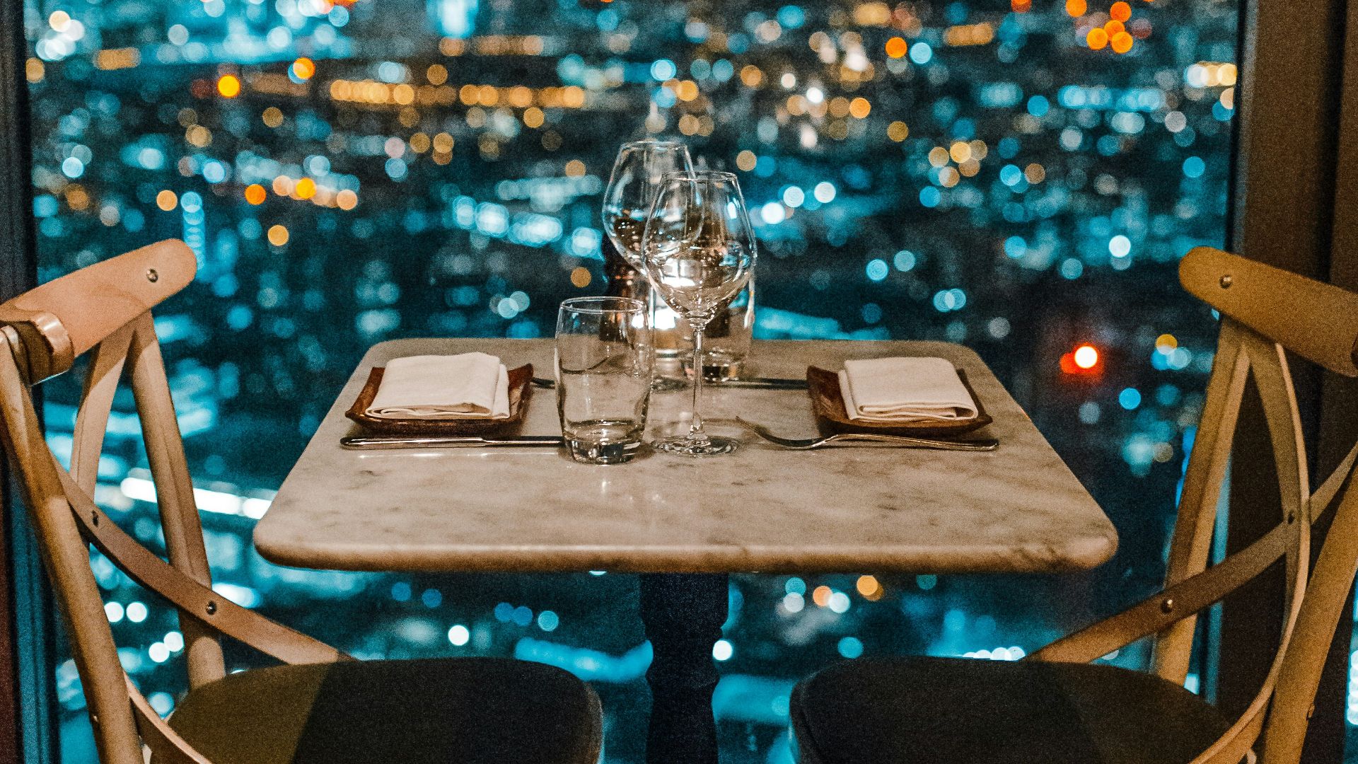 white ceramic table and chairs with glassware