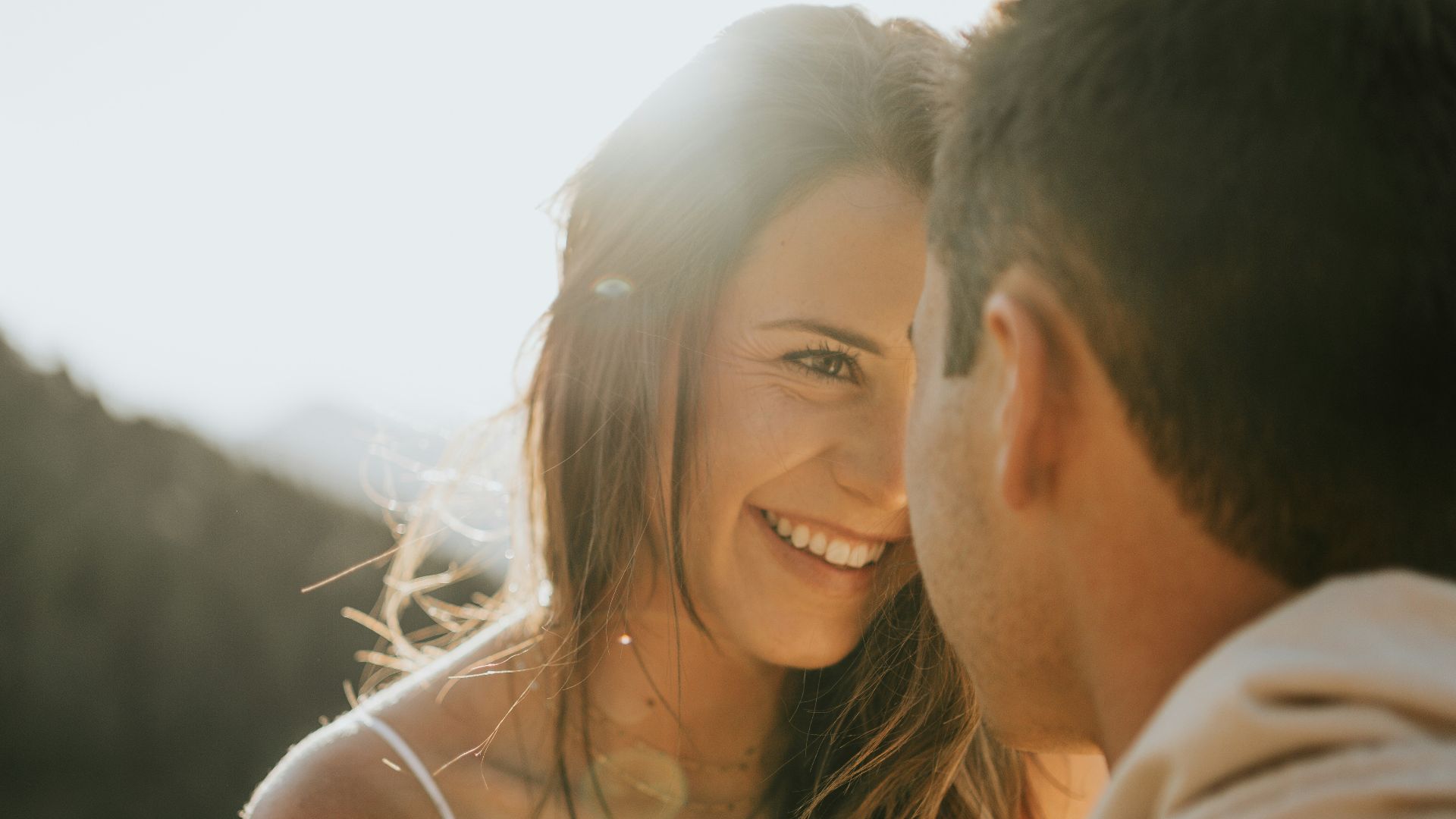 man and woman kissing during daytime