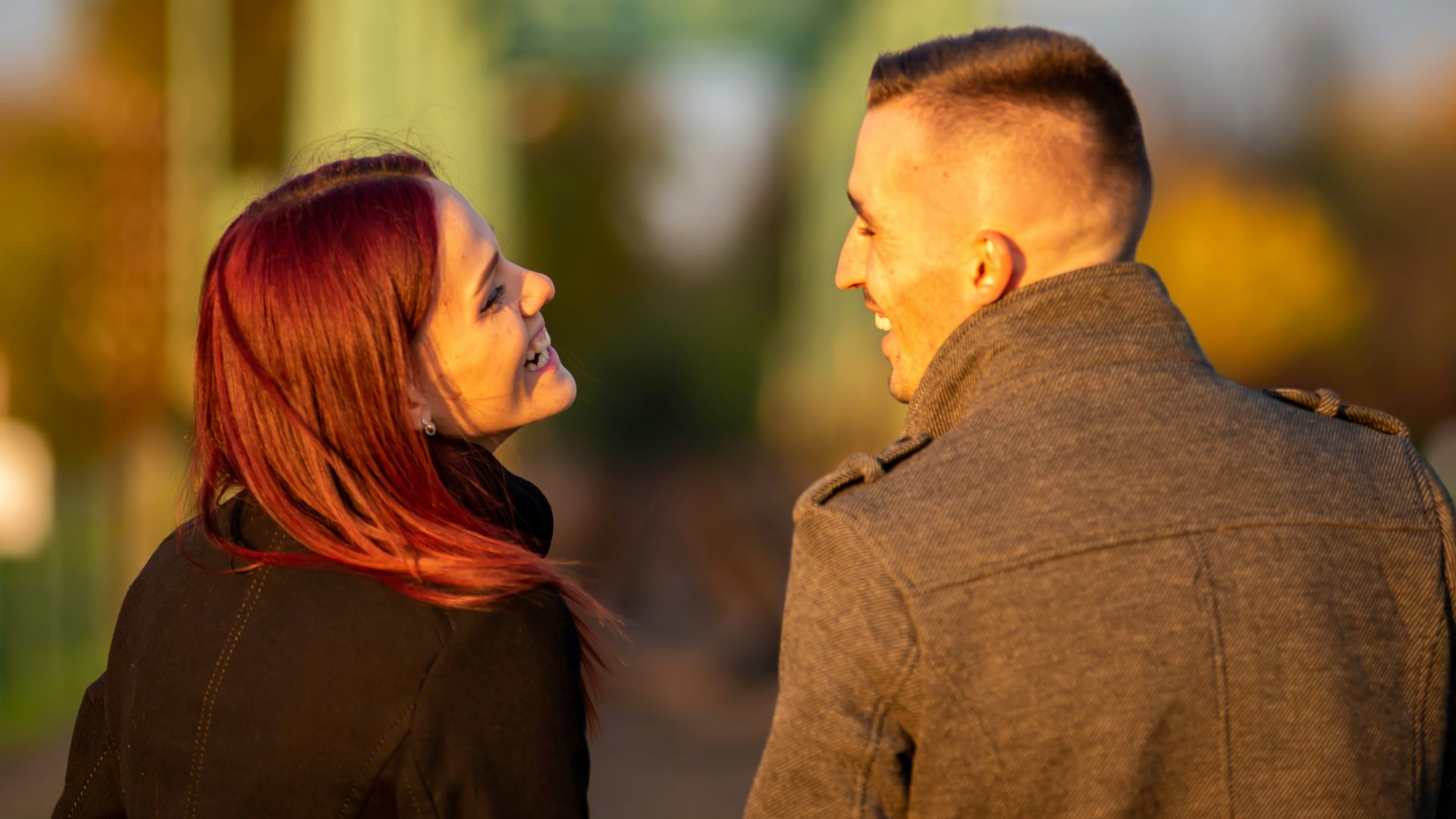 man and woman standing side by side during daytime