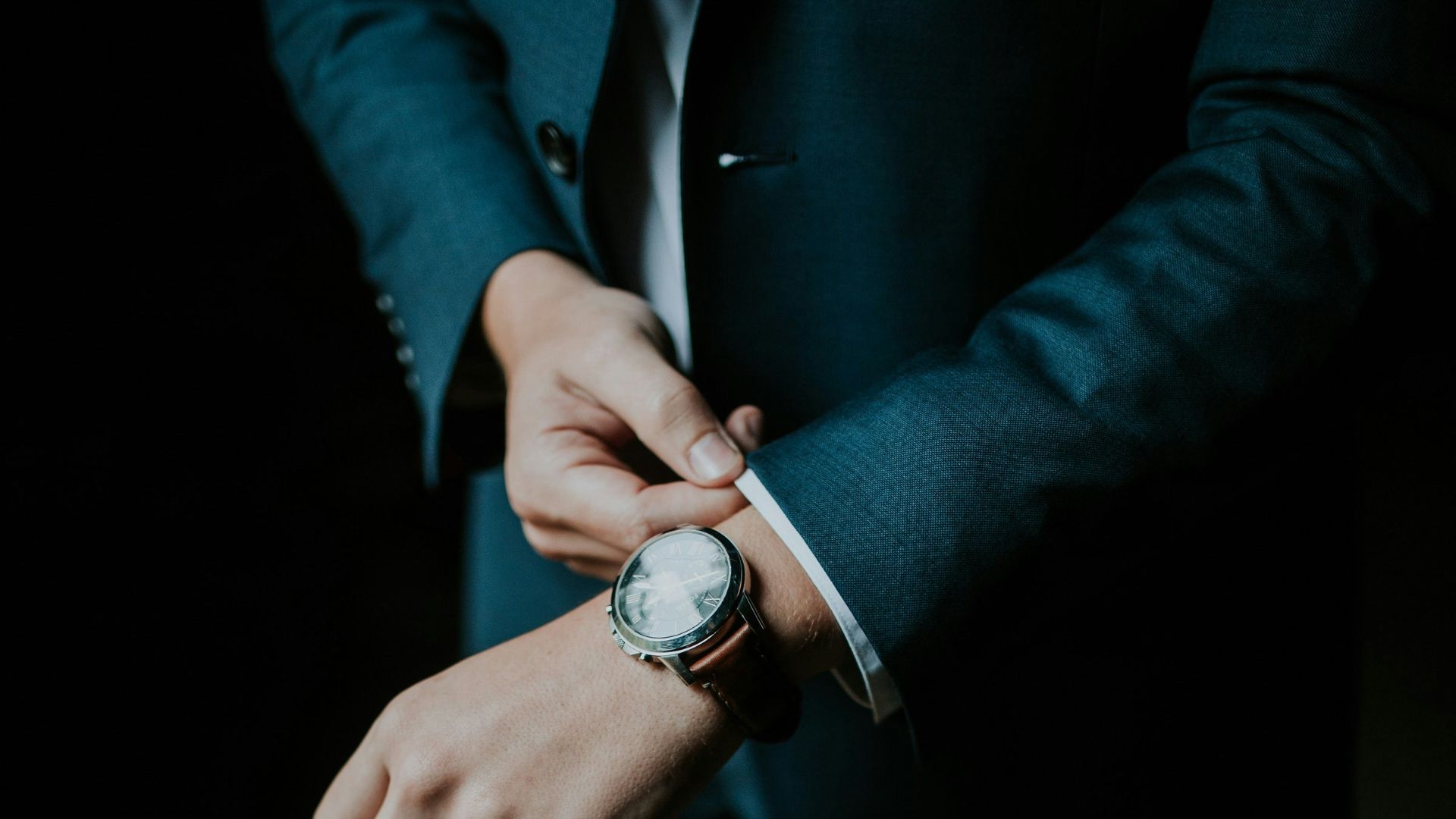 man holding his black suit