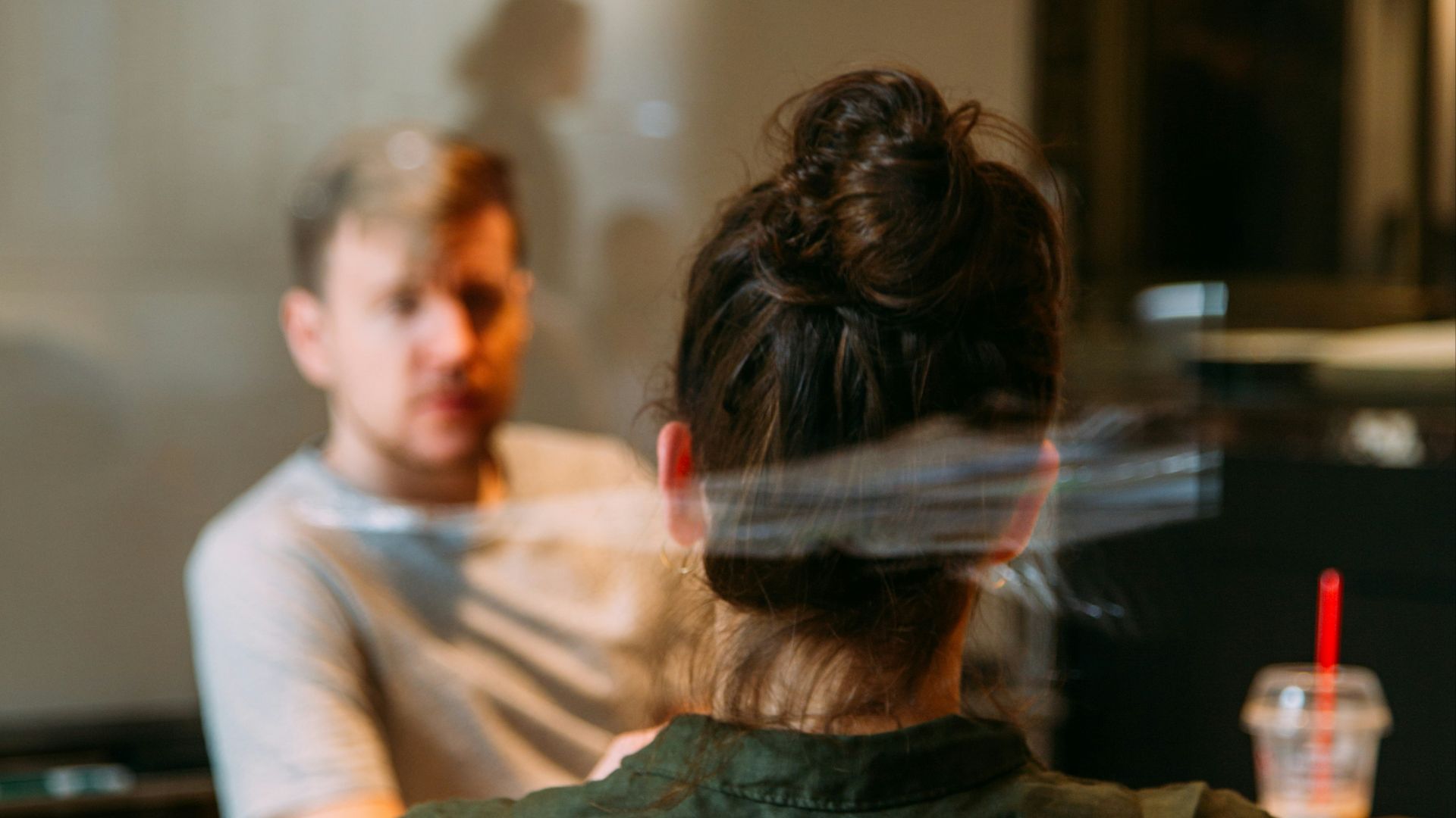 person sitting in a chair in front of a man