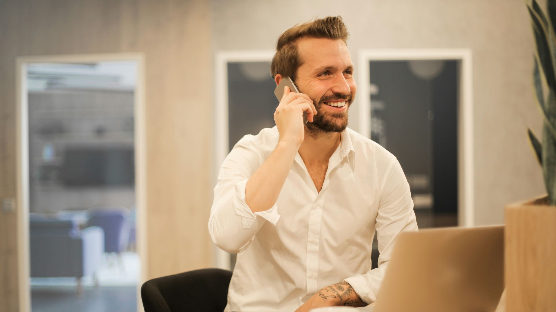 man using smartphone on chair