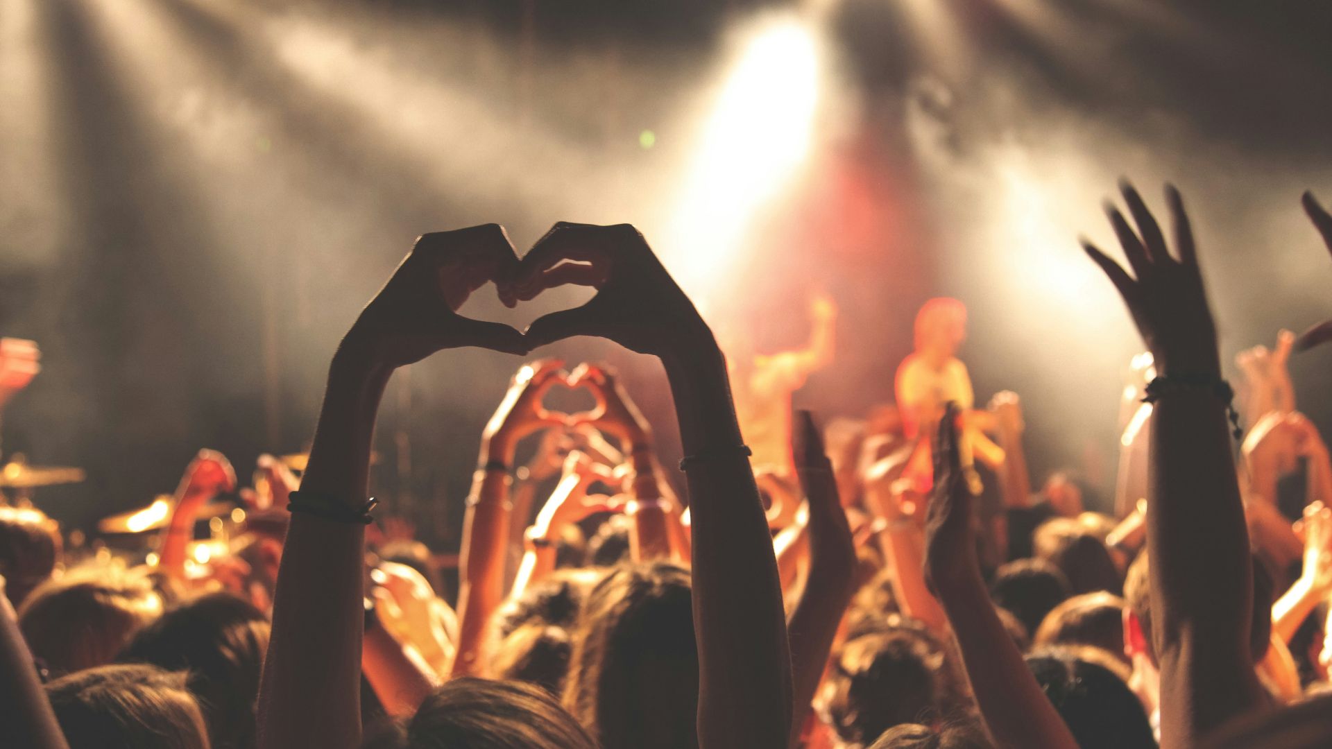 person performing heart hand gesture