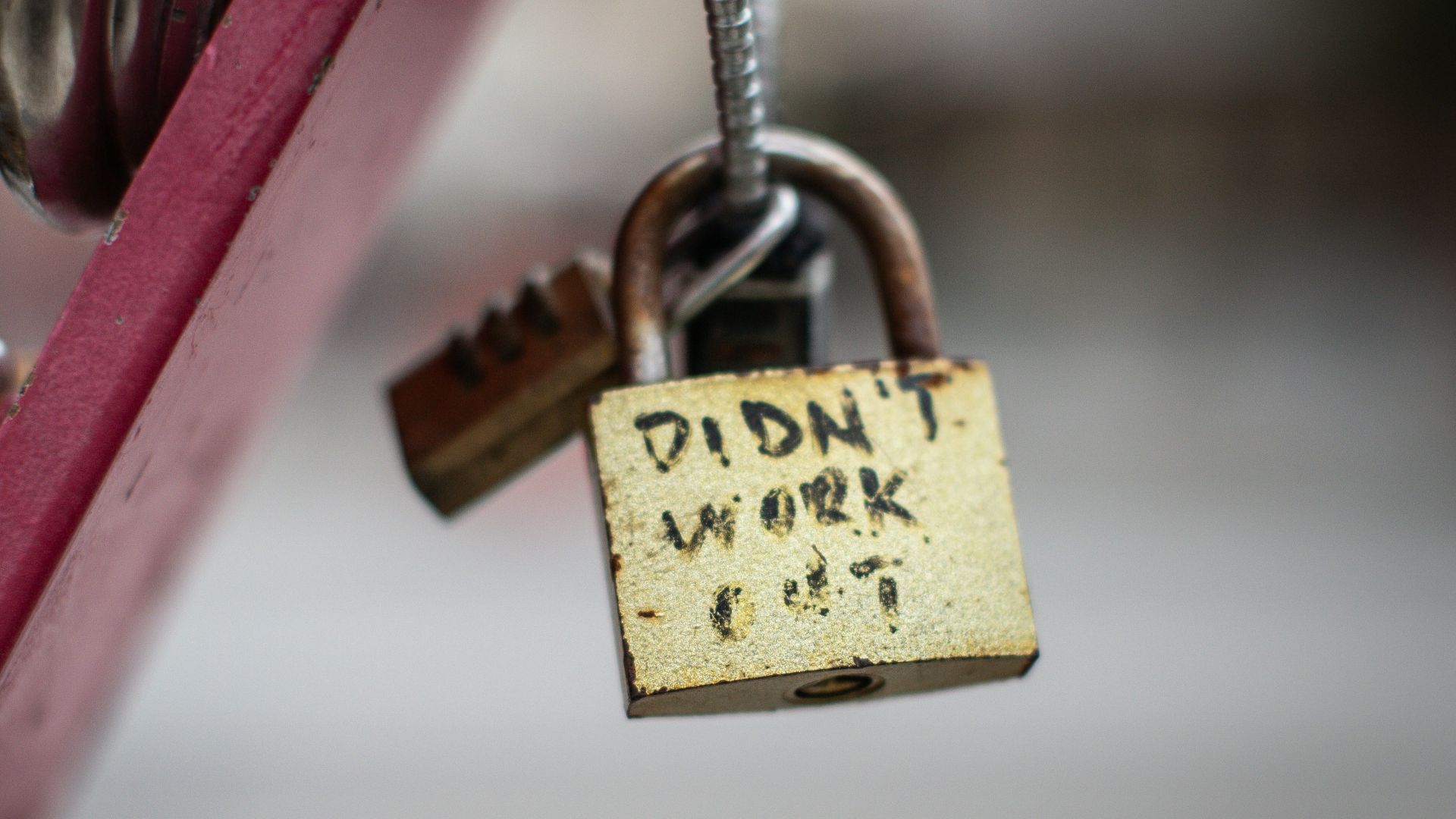 a padlock attached to a red bike with the words didn't work on