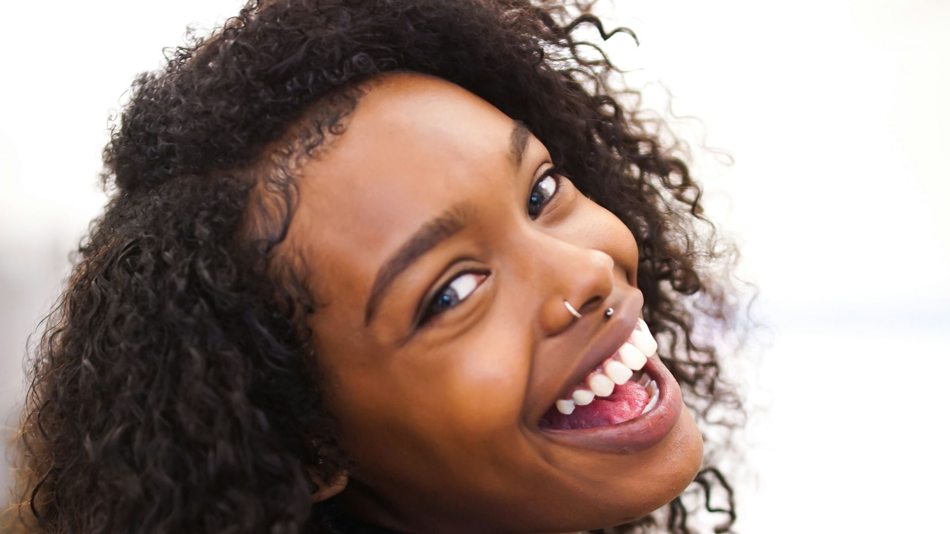 woman looking back while smiling