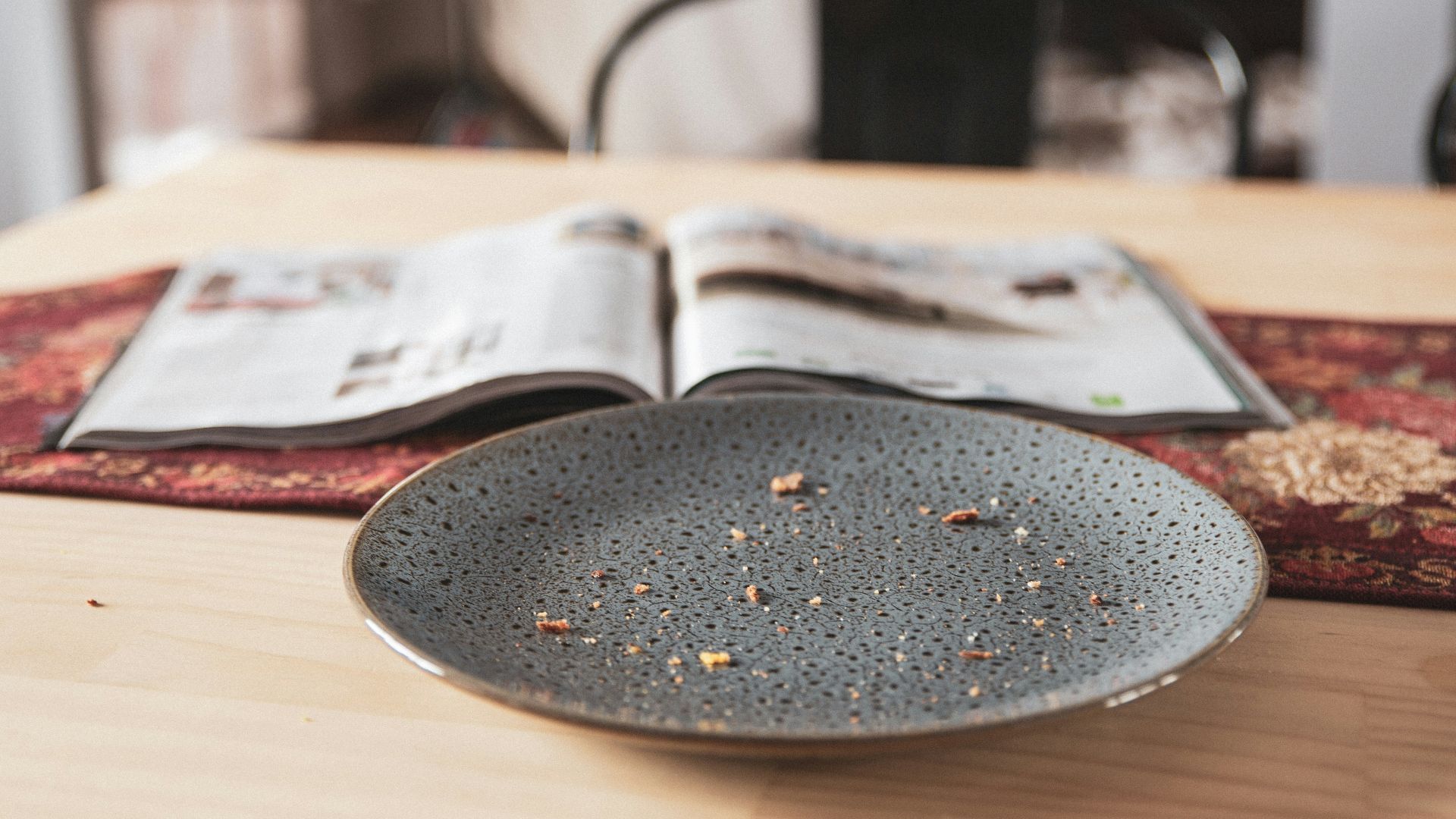 black round plate on brown wooden table