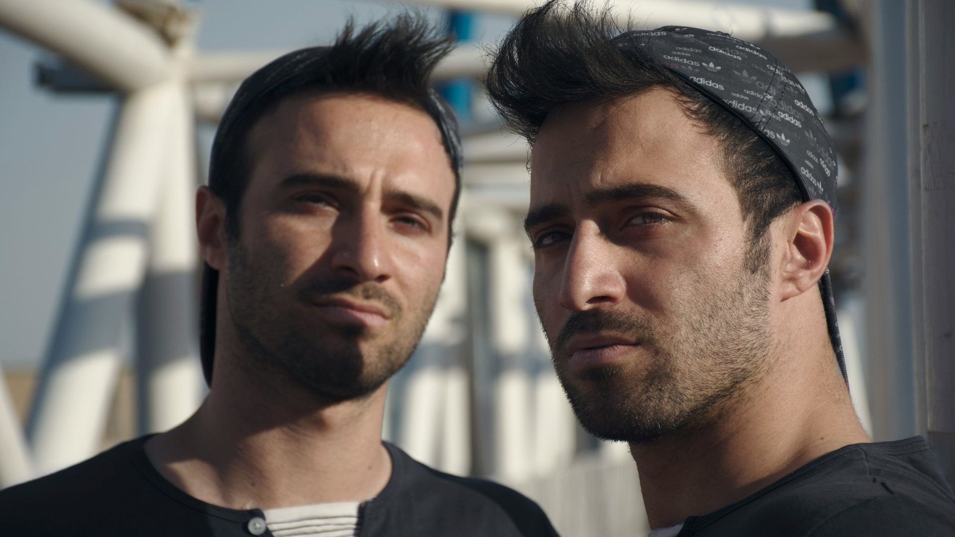 a couple of men standing next to each other