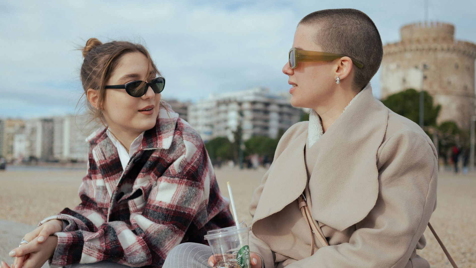 a man and a woman sitting next to each other