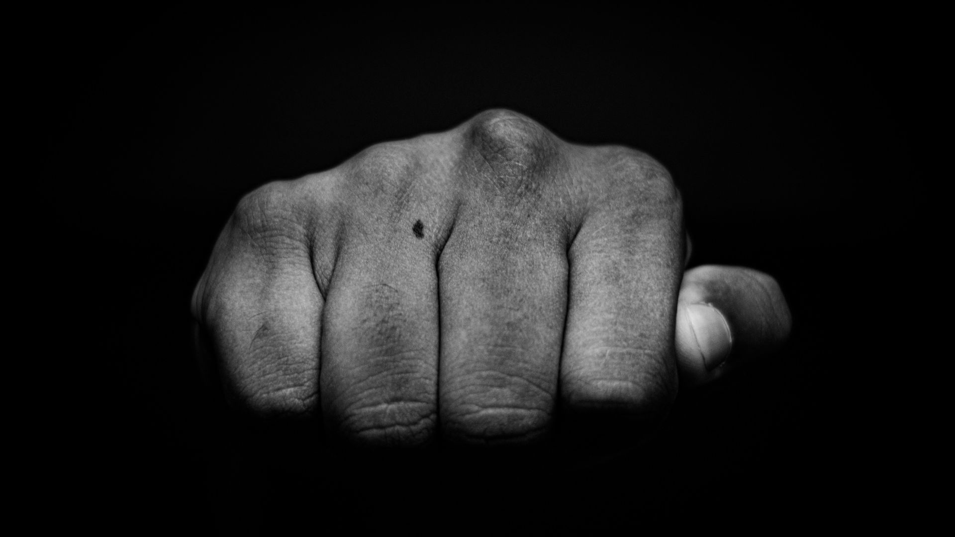 a hand with a black background