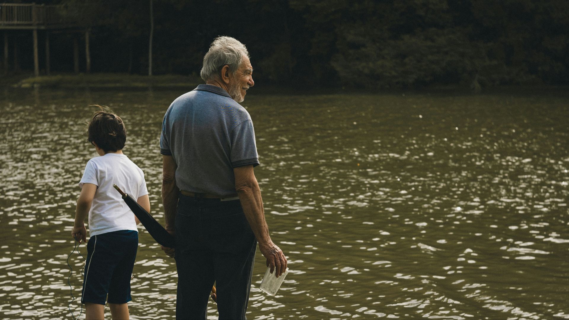 Man and boy by a lake