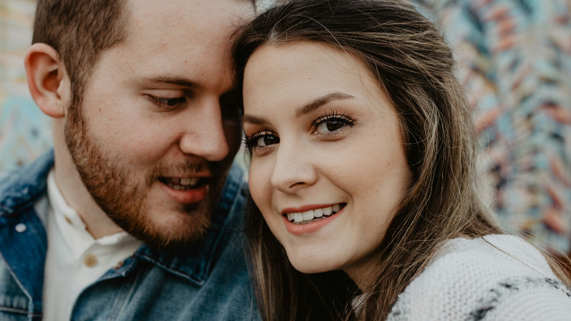 woman and man wearing white sweater