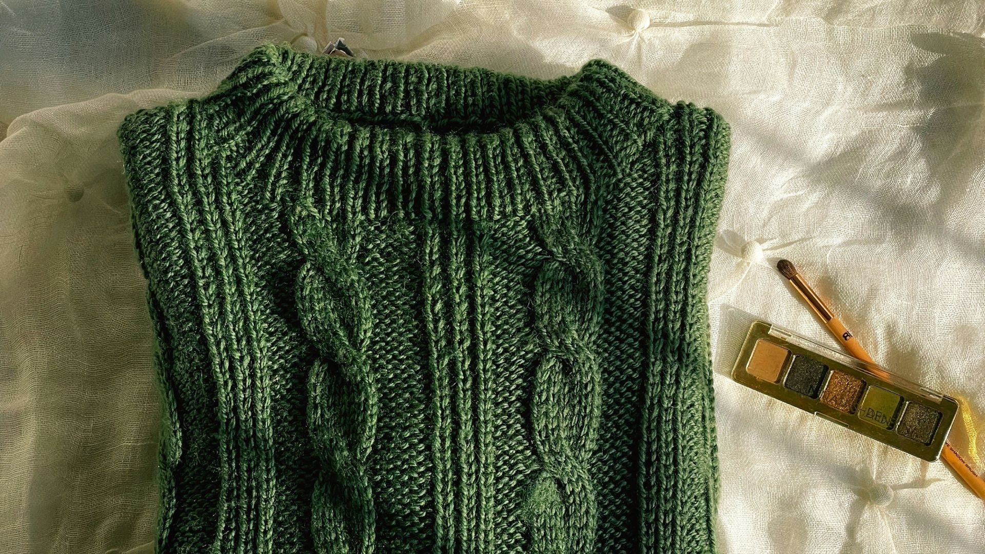 a green knitted piece of clothing