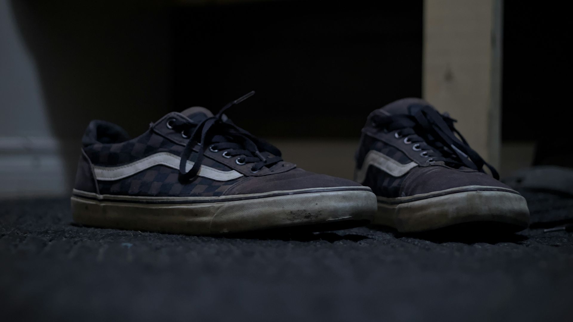 A pair of shoes sitting on the ground