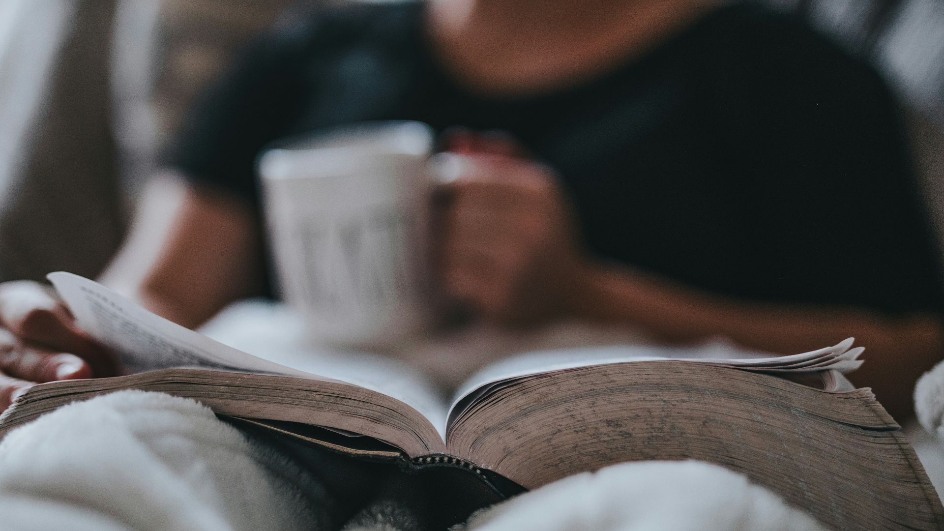 person holding coffee mug