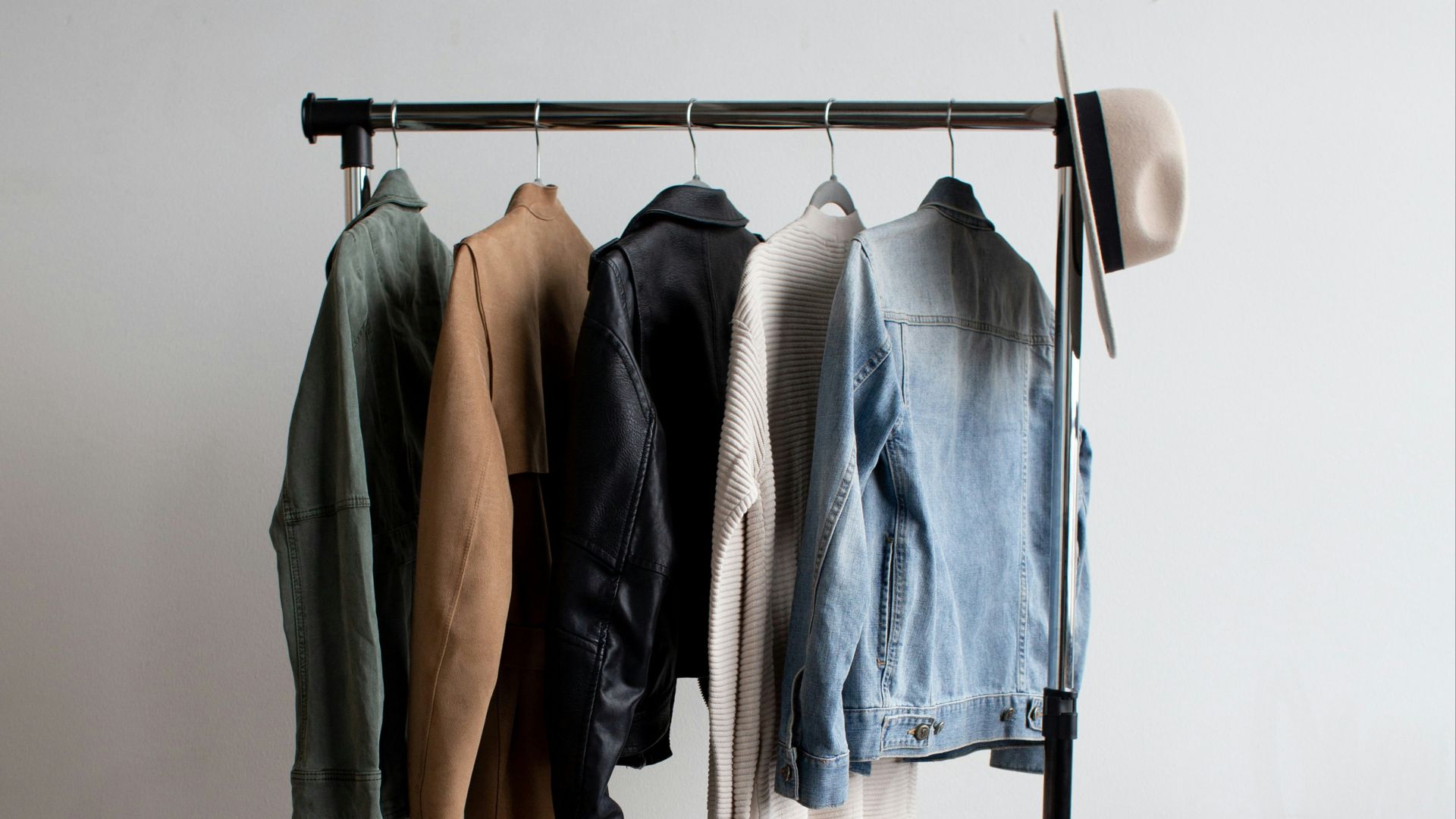 five jackets on clothes rack