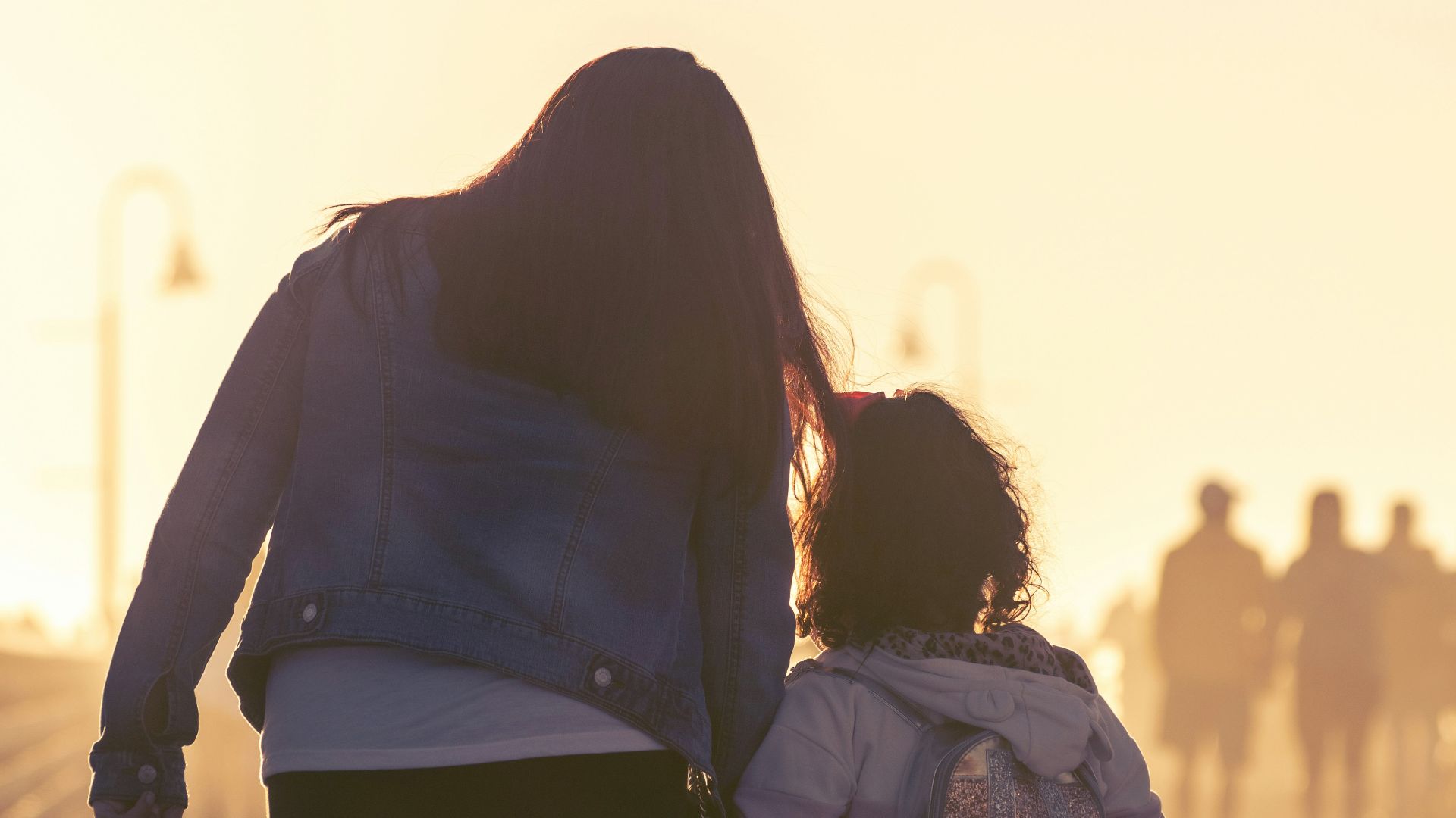 2 women walking on the road during daytime