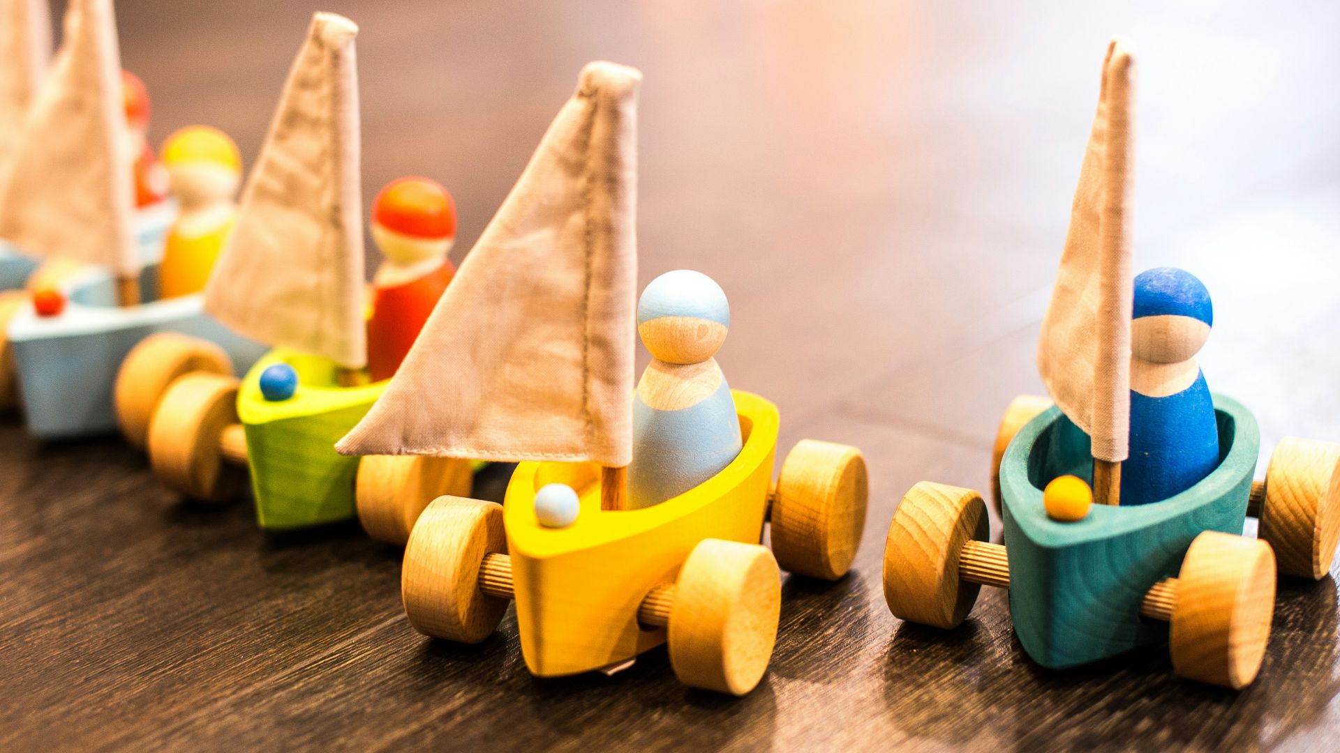 five assorted-color racing car toys