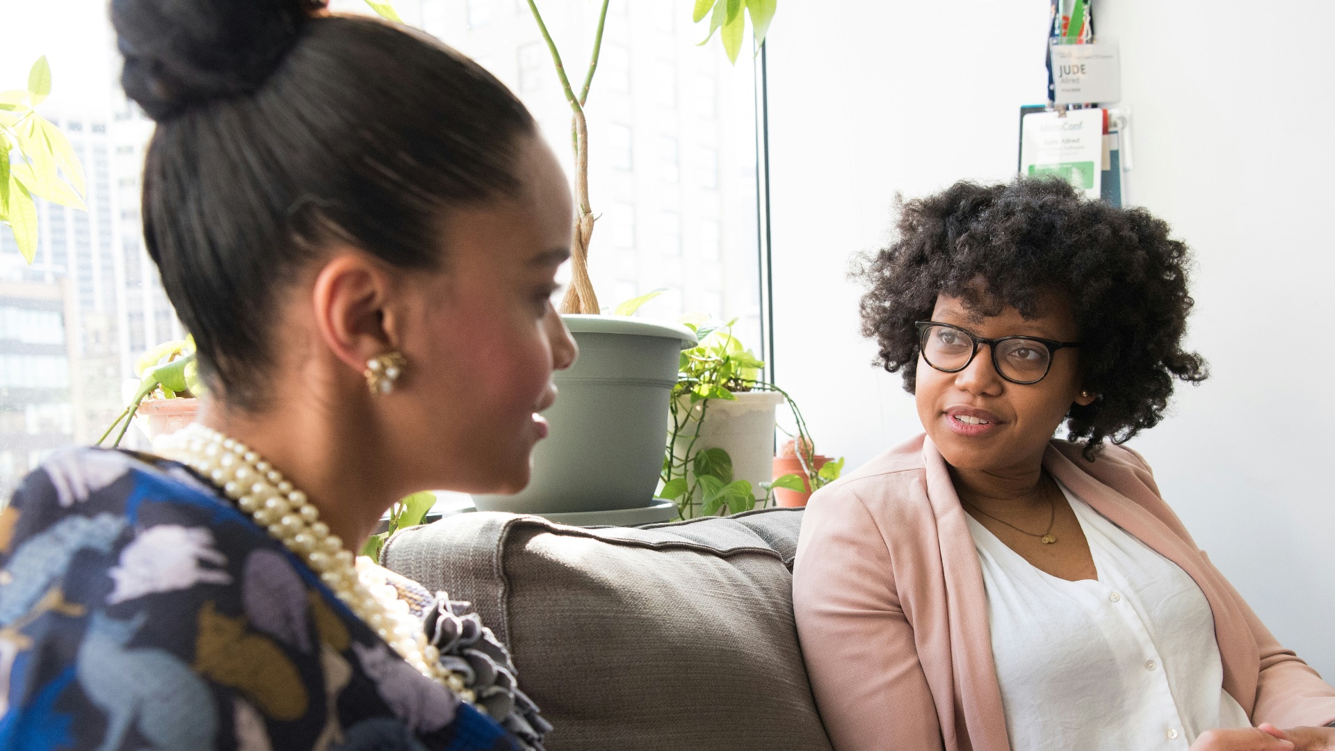 shallow focus photo of woman in beige open cardigan
