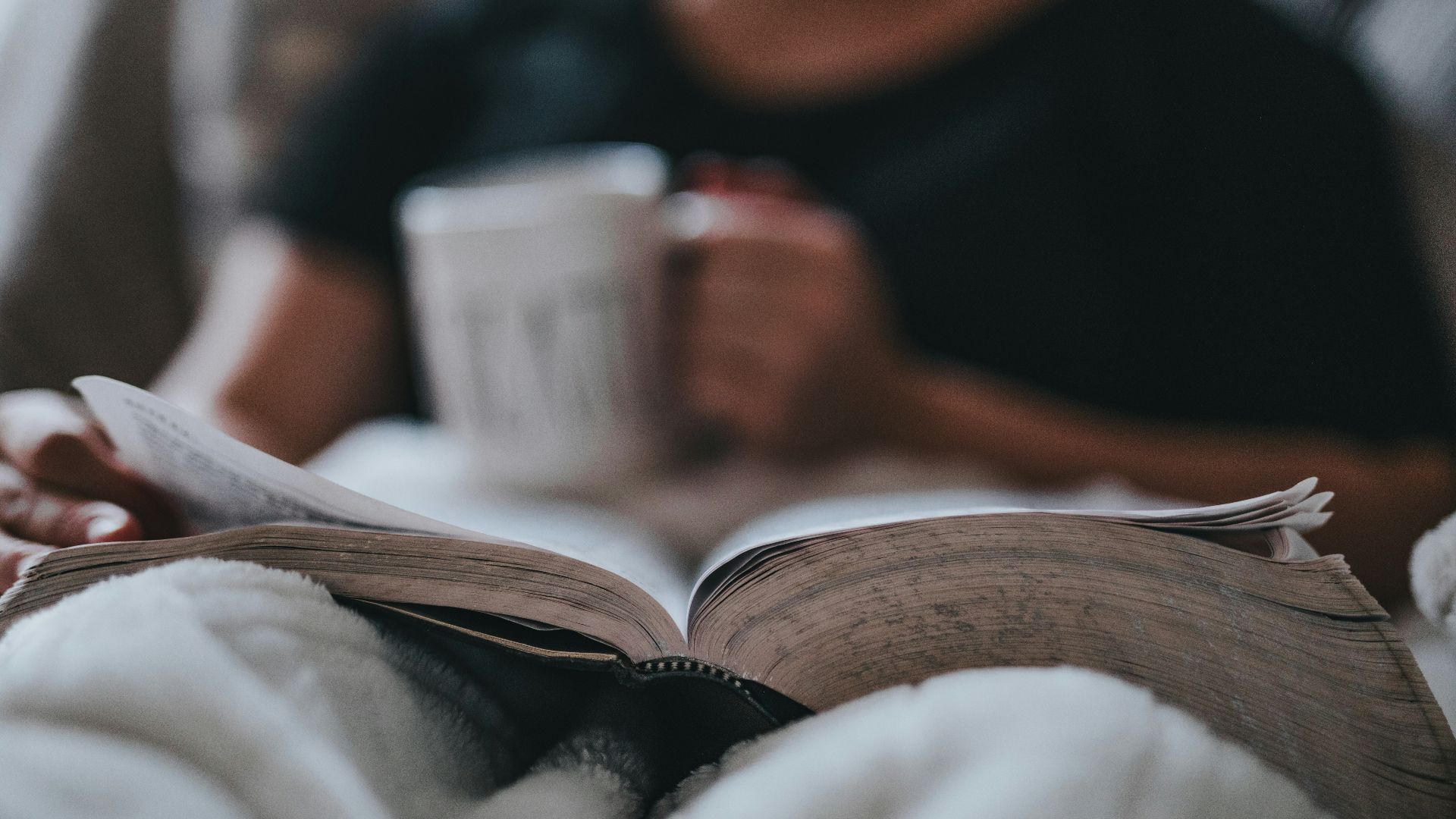 person holding coffee mug