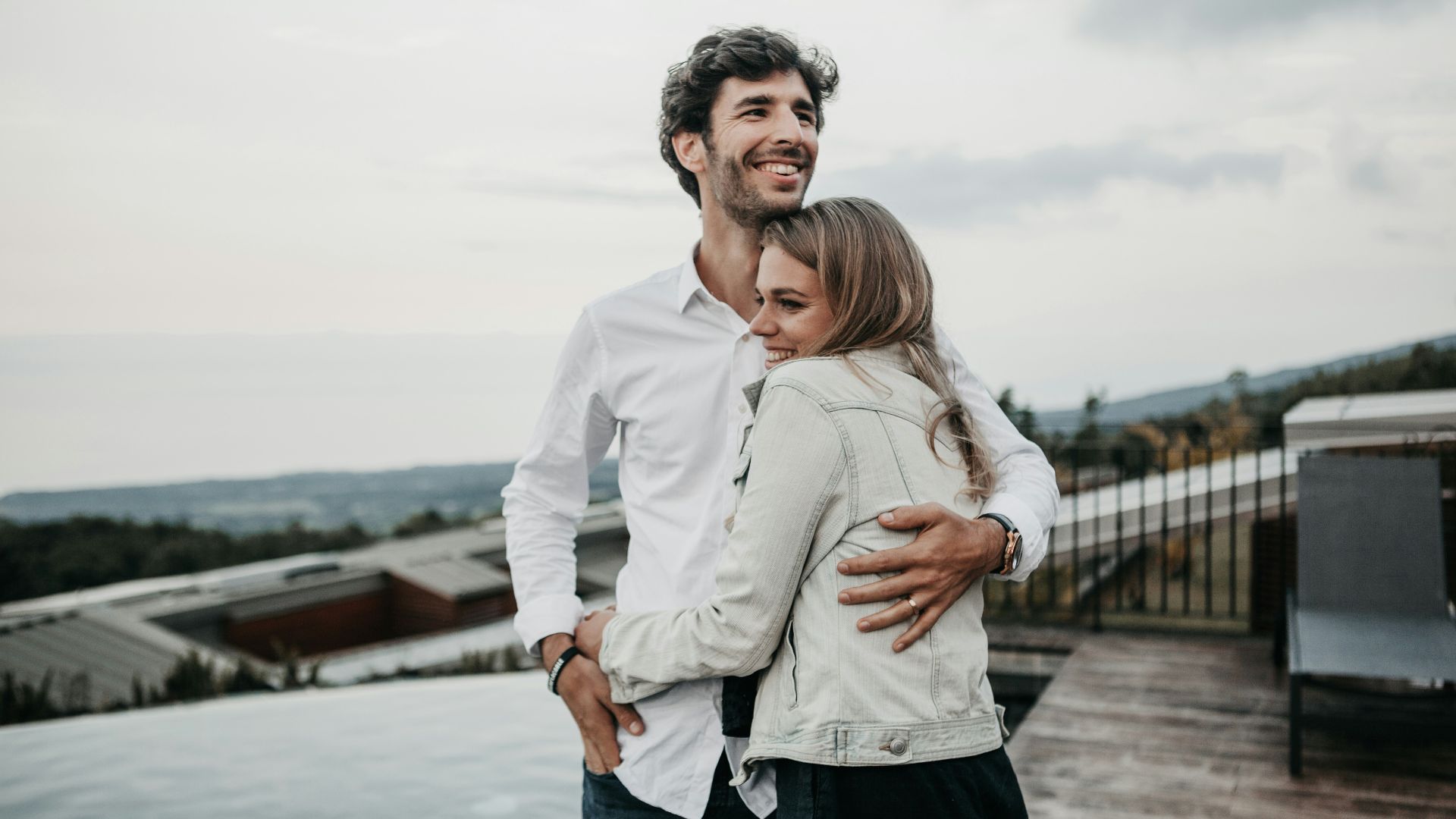 man and woman hugging each other