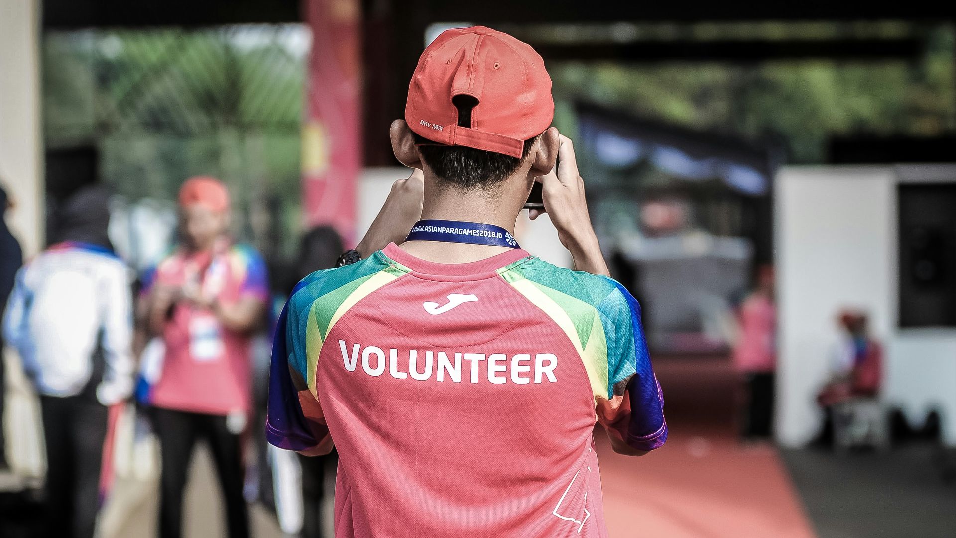 person standing wearing red shirt