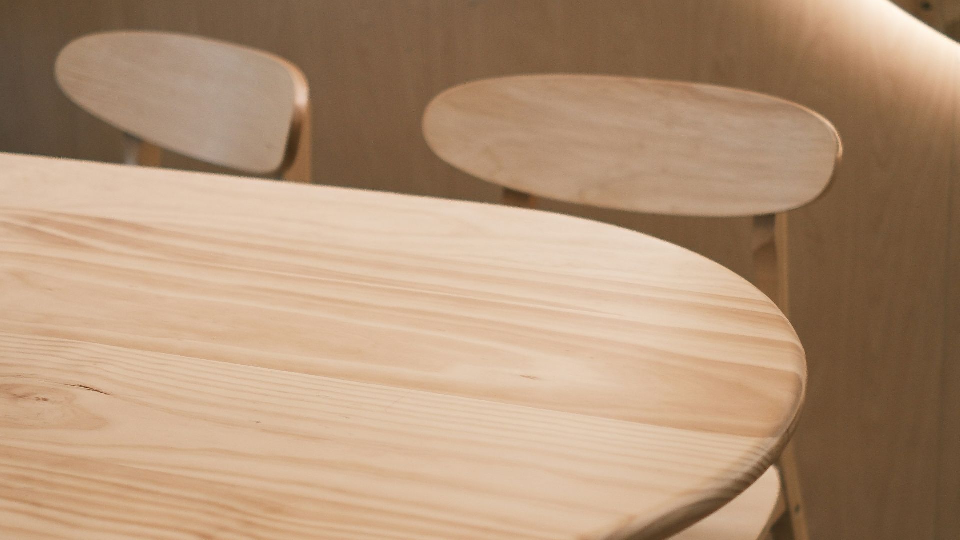 A wooden table and chairs in a room