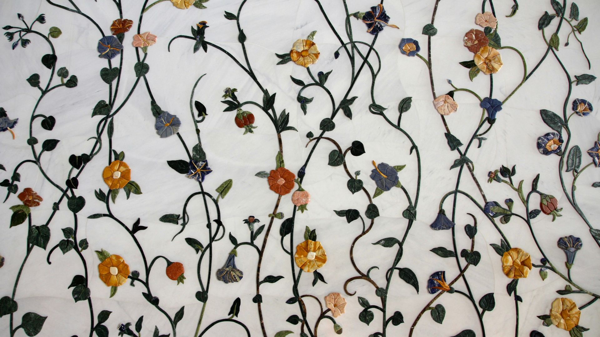 white, orange, and purple floral textile