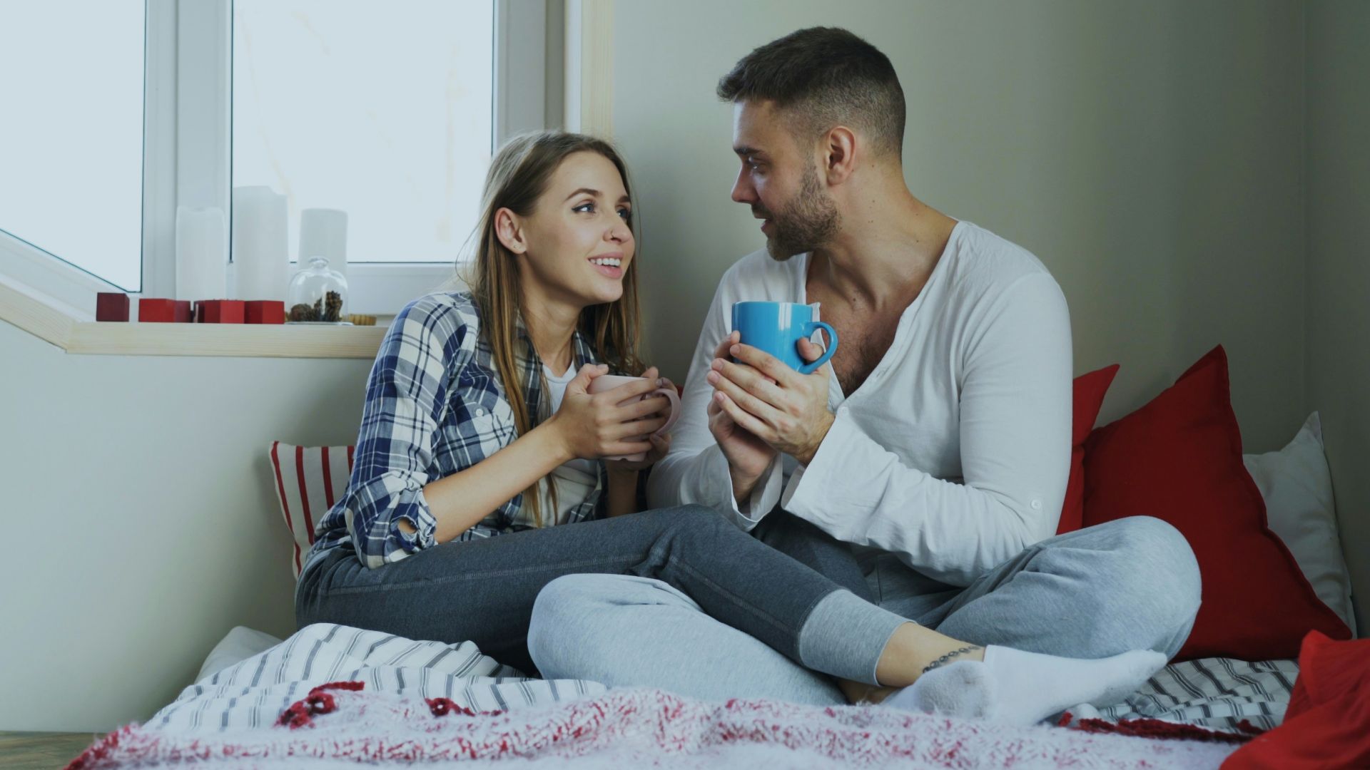 Couple enjoying drinks by the window