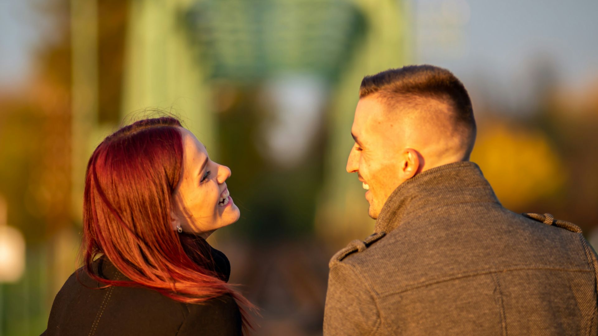 man and woman standing side by side during daytime