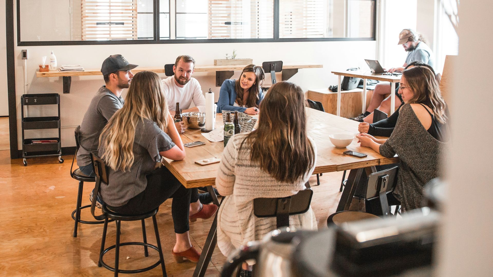 talking people sitting beside table