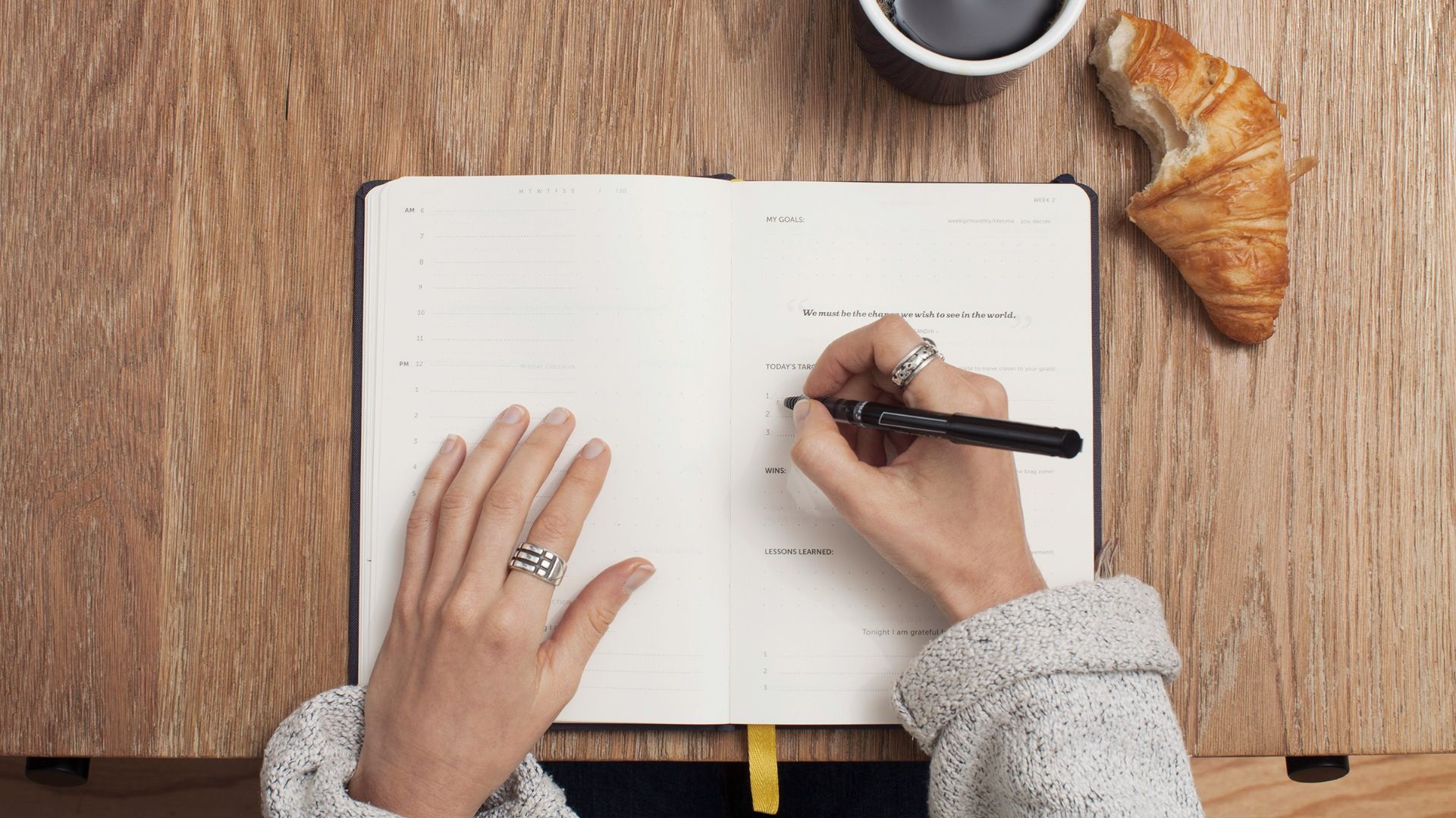 person writing on a book