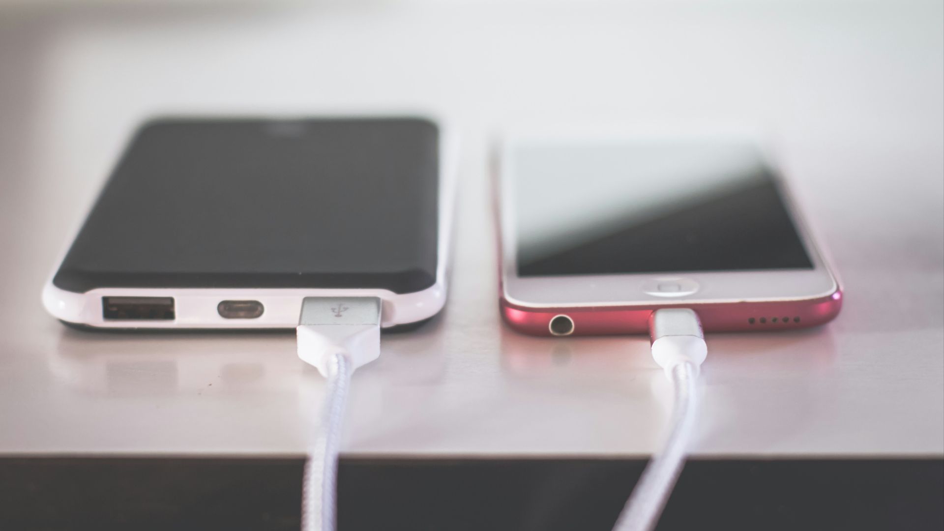 two phones on white table
