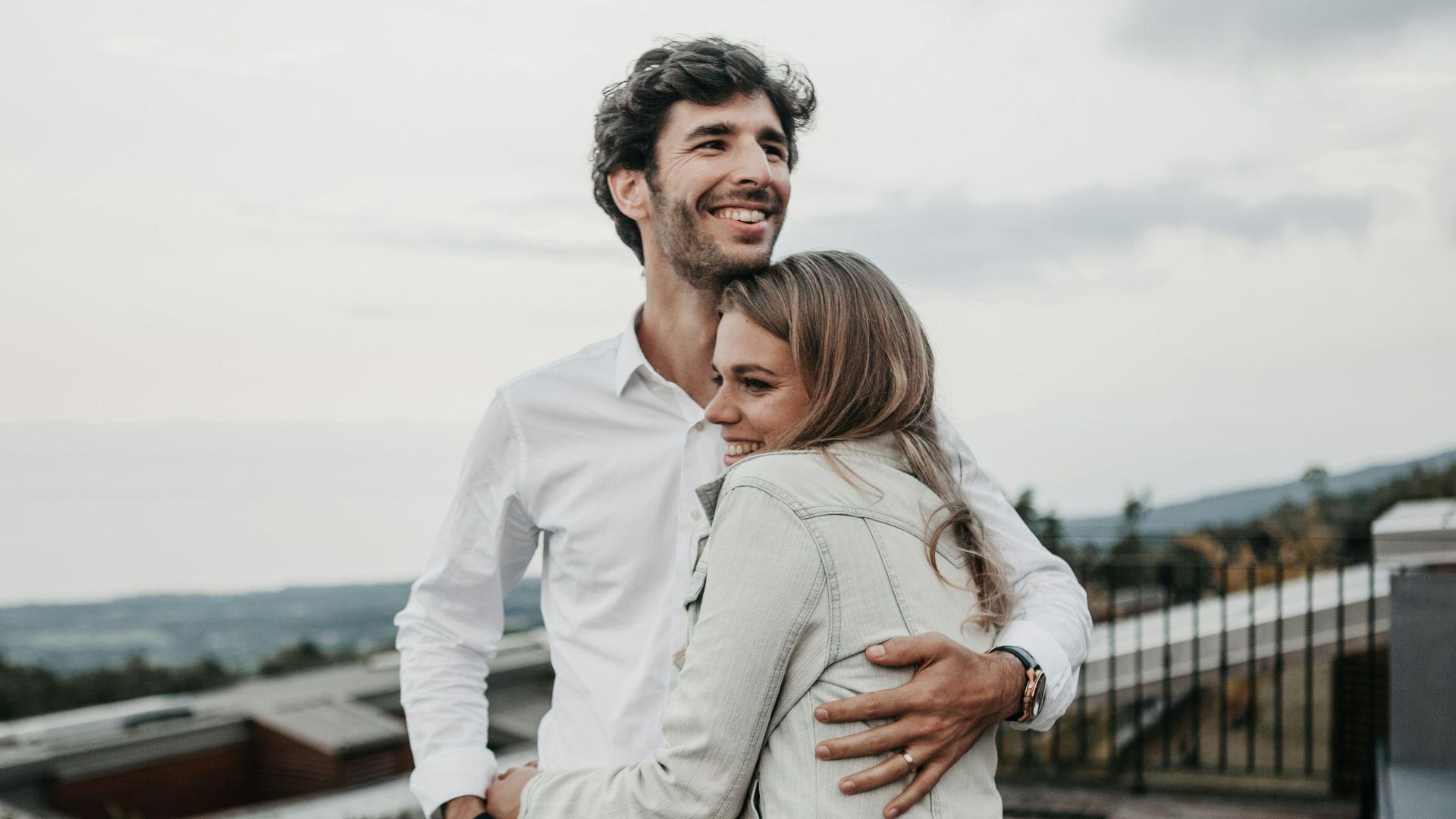 man and woman hugging each other