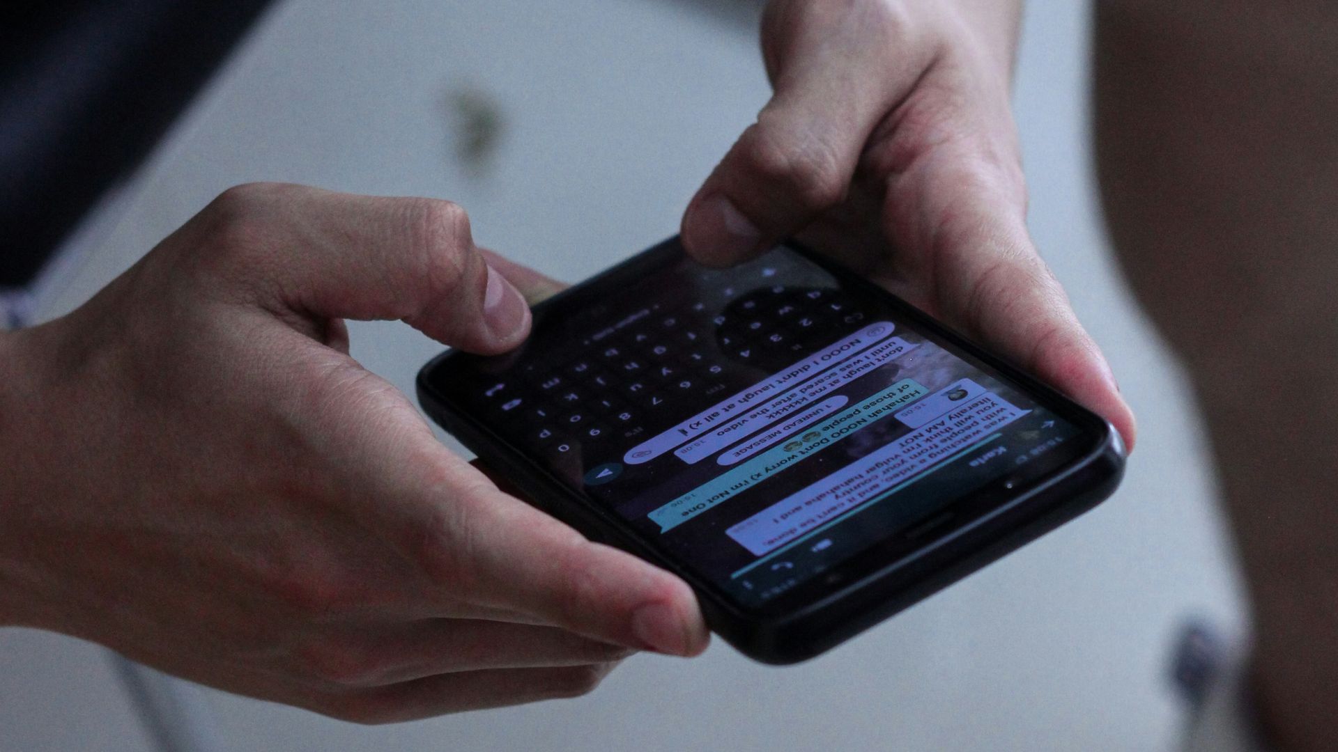 person holding black iphone 4